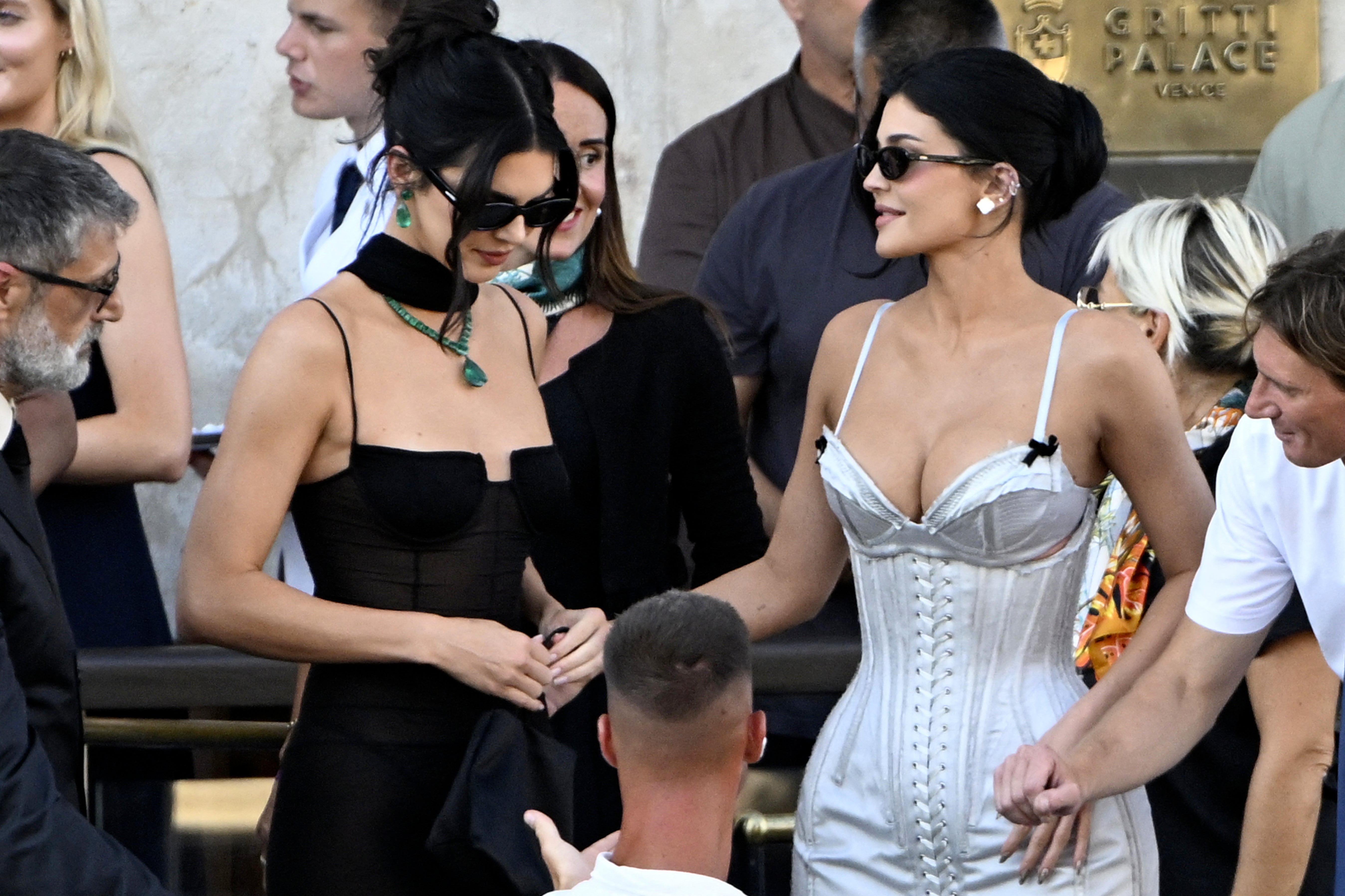 Jenner’s dress featured a bra-like neckline with delicate black bows on the straps attached to a lace-up corseted bodice, and a slim-fitting, silky skirt