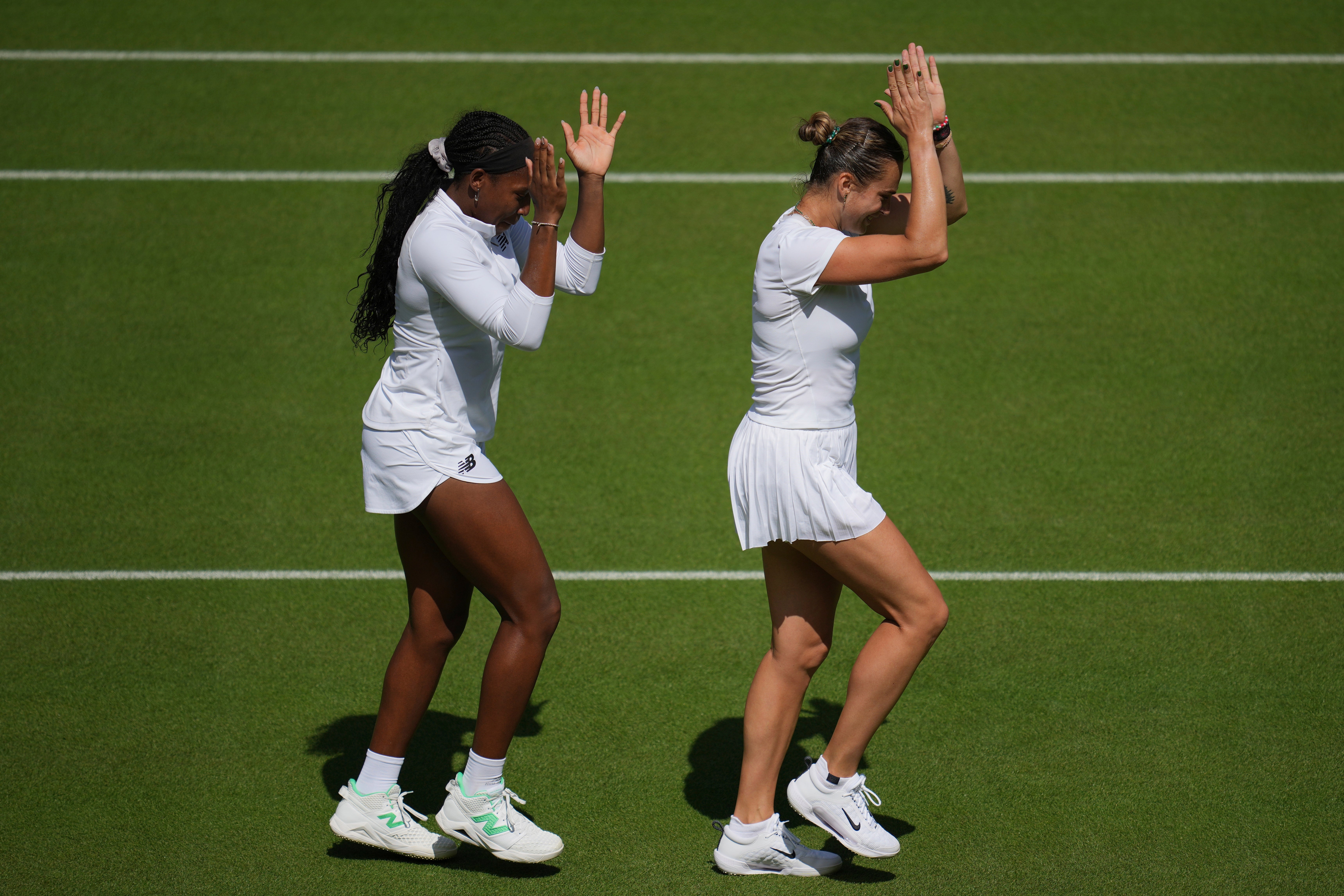 Aryna Sabalenka of Belarus, right, and Coco Gauff of the United States during a practice session ahead of the Wimbledon Championships in London