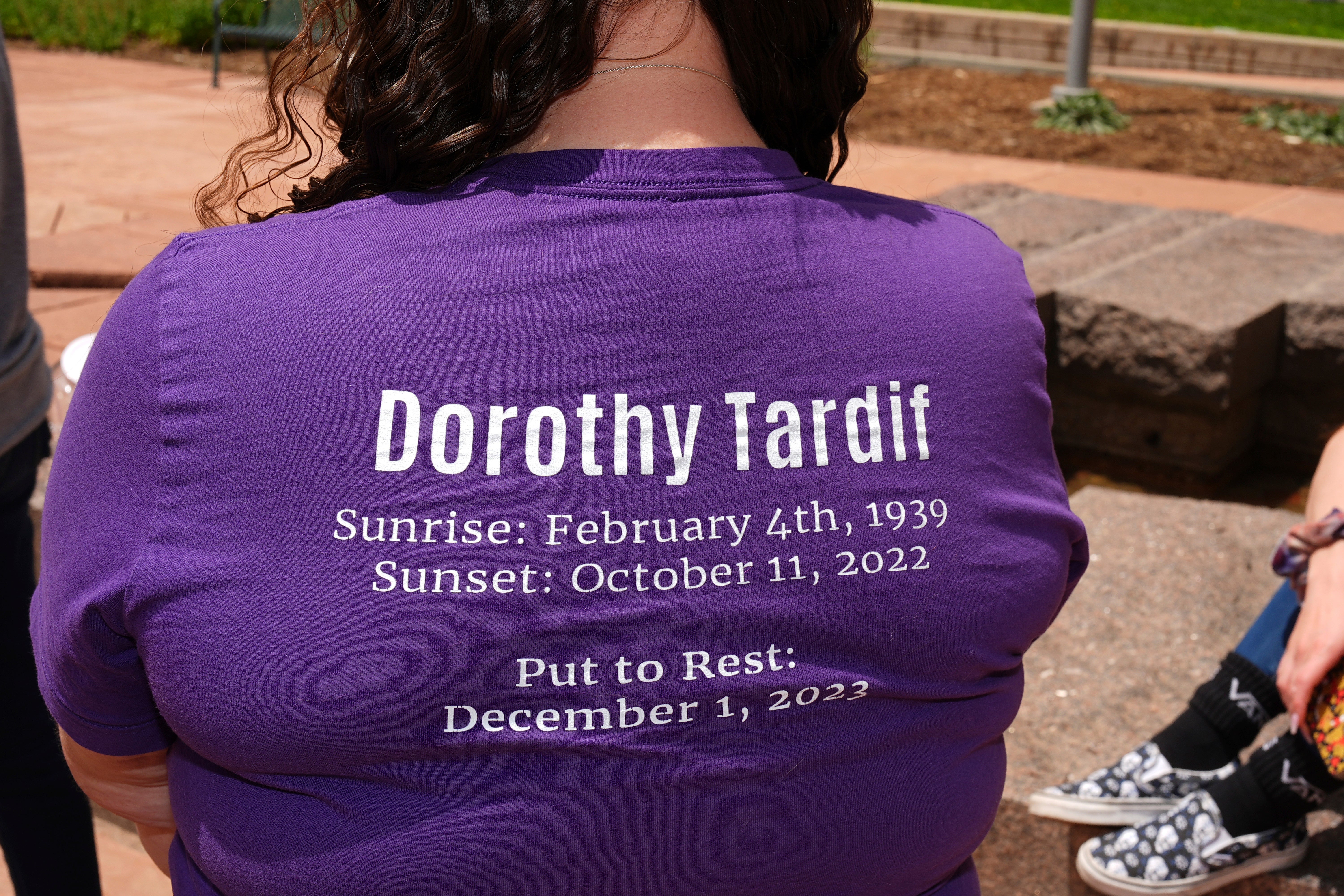 Samantha Naranjo of Colorado Springs, Colo., wears a shirt in honor of her late grandmother, Dorothy Tardif, outside the courtroom