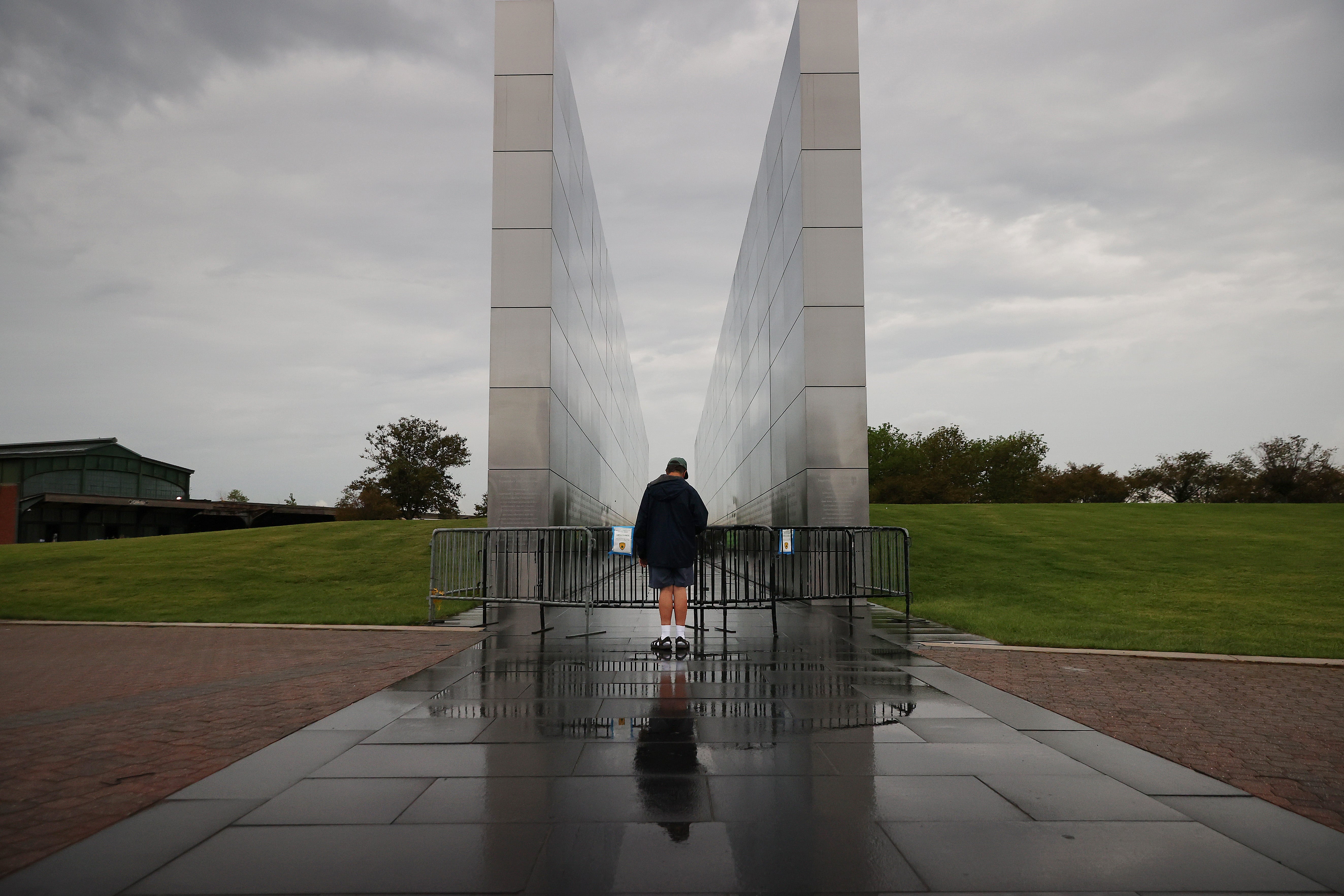 The monument in Jersey City’s Liberty State Park consists of two brushed stainless steel twin walls, 210 feet long, the width of each side of the World Trade Center Towers. Outside, the concrete walls are bare and have become stained over the years.