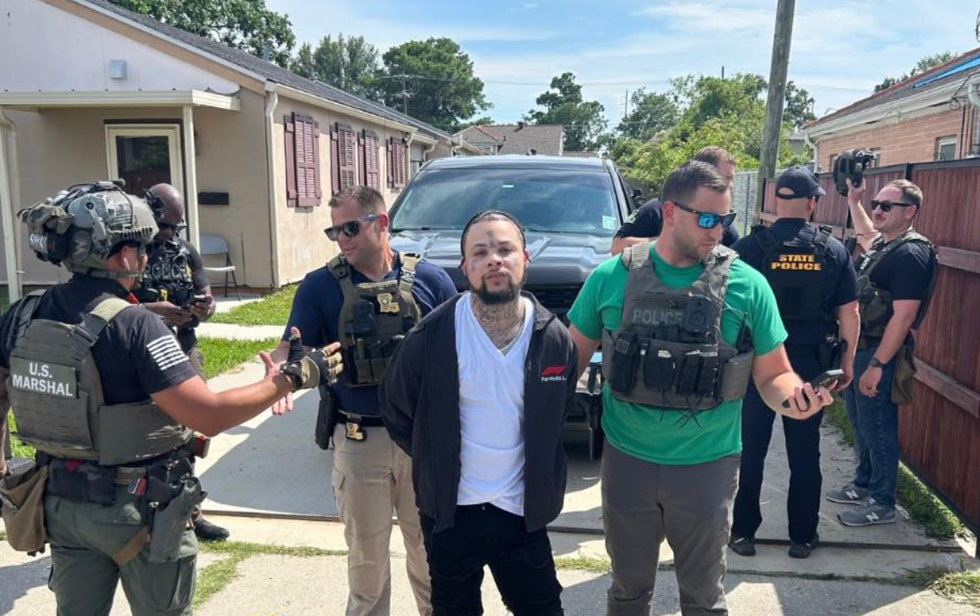 Massey looked directly in the camera while implementing the law photographed his arrest.