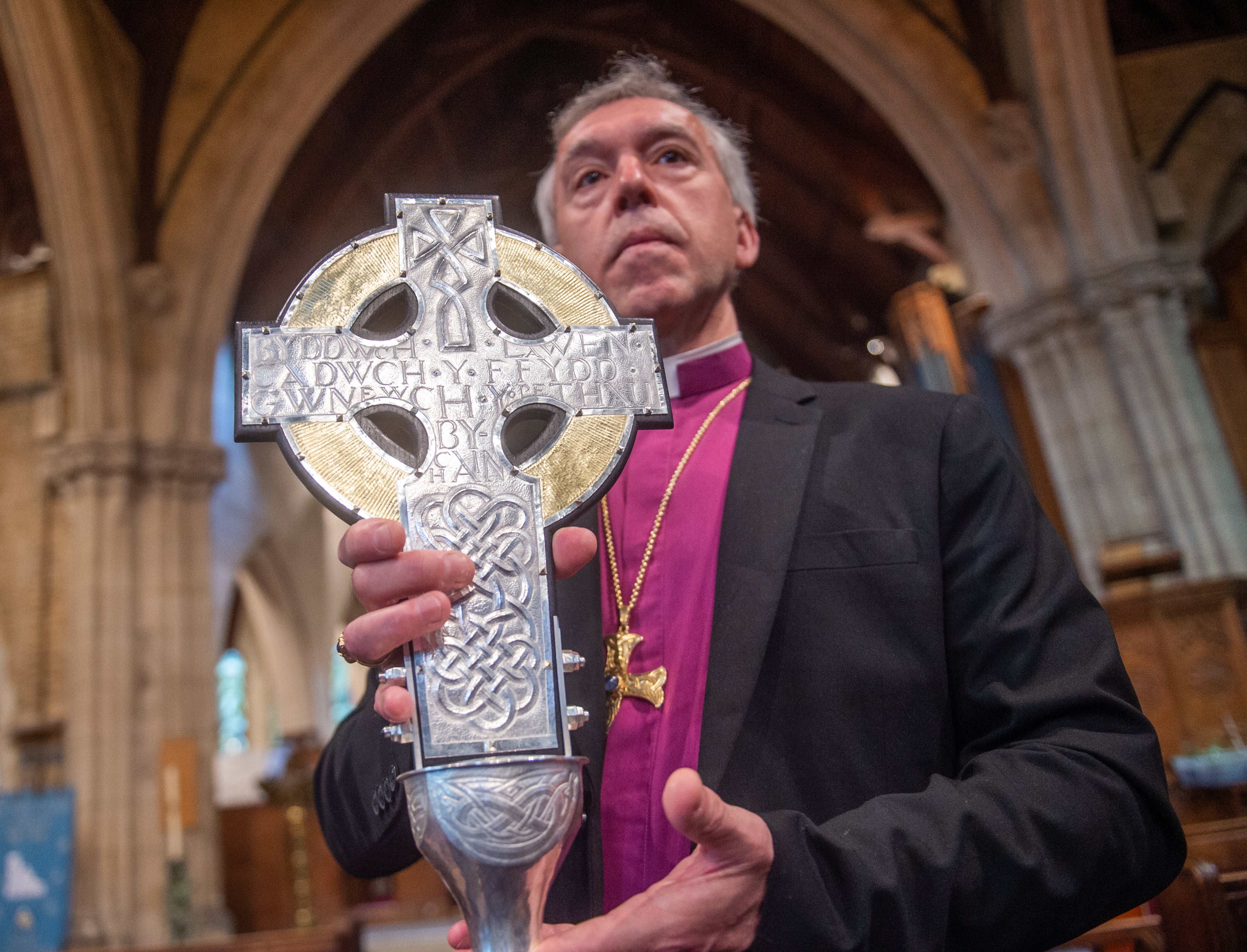 Archbishop of Wales Andrew John with the Cross of Wales