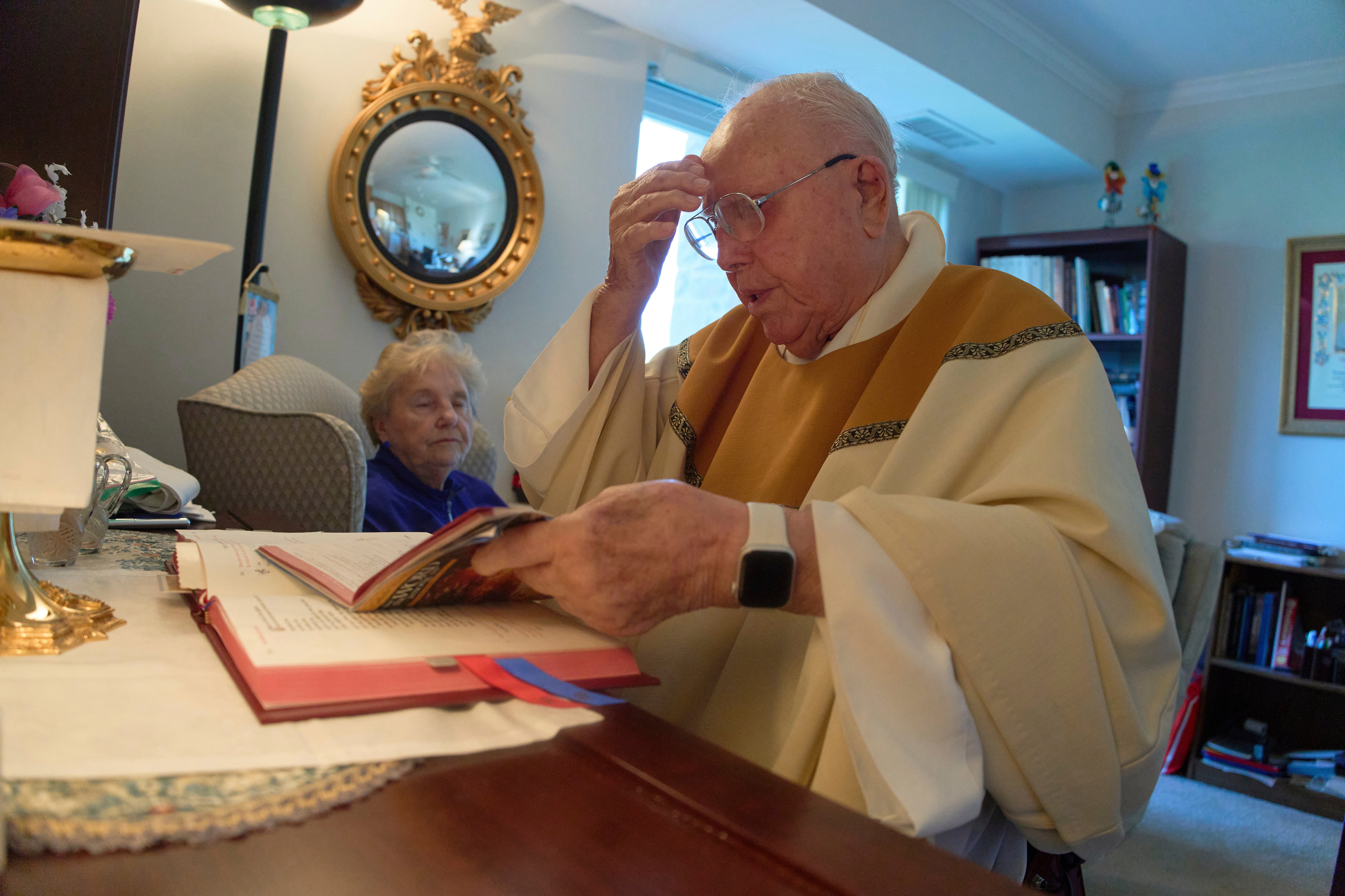 Rev. James Kelly celebrates Mass in his apartment