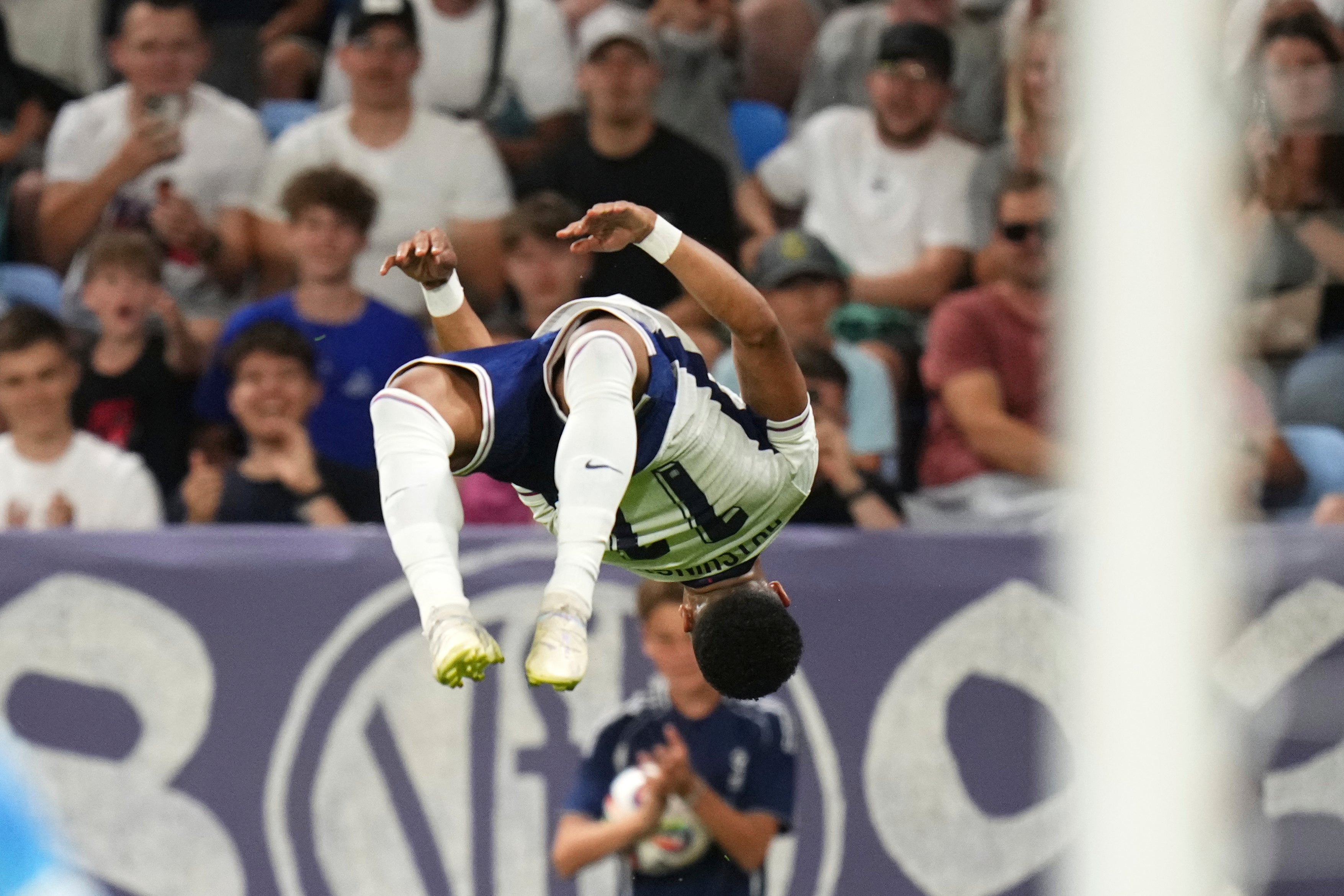 Omari Hutchinson celebrates his goal in the final against Germany