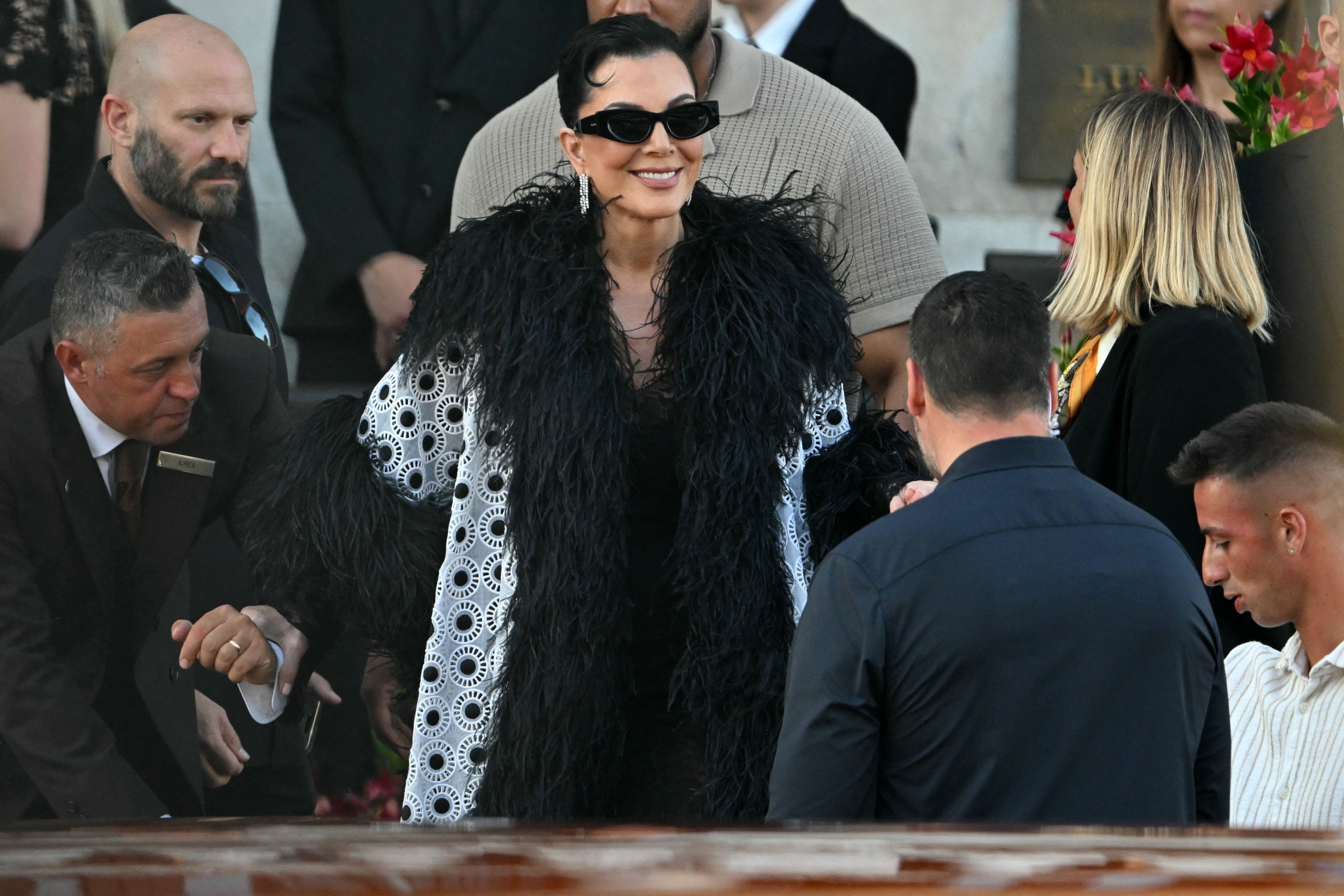 Jenner left for the reception on Saturday dressed like Cruella de Vil, complete with a black feather coat with a black and white pattern