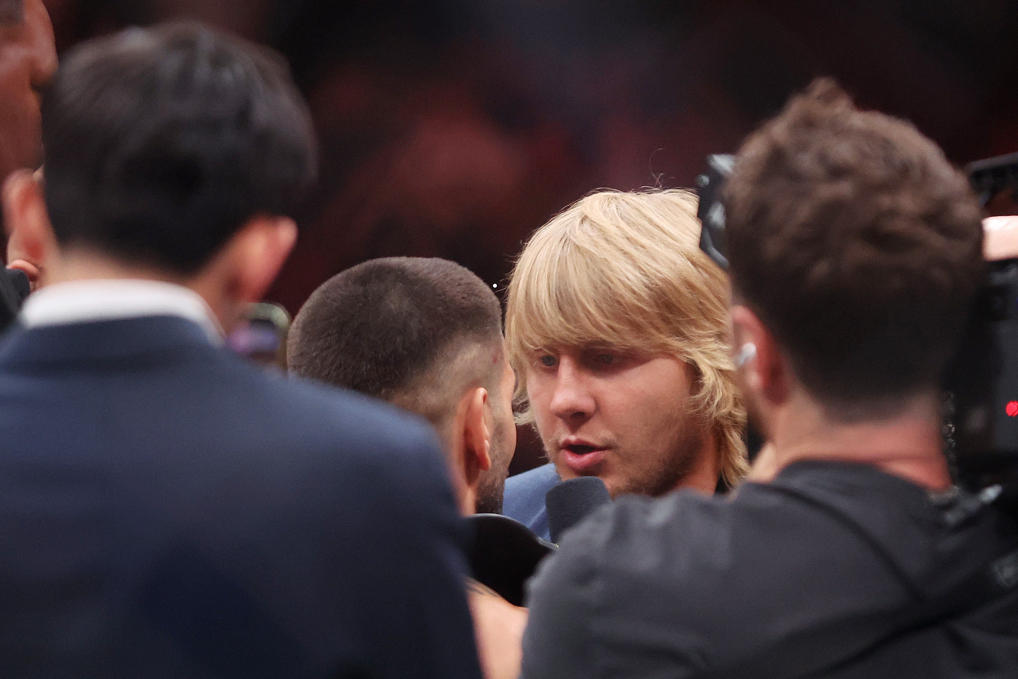 Paddy Pimblett (right) facing off with Ilia Topuria