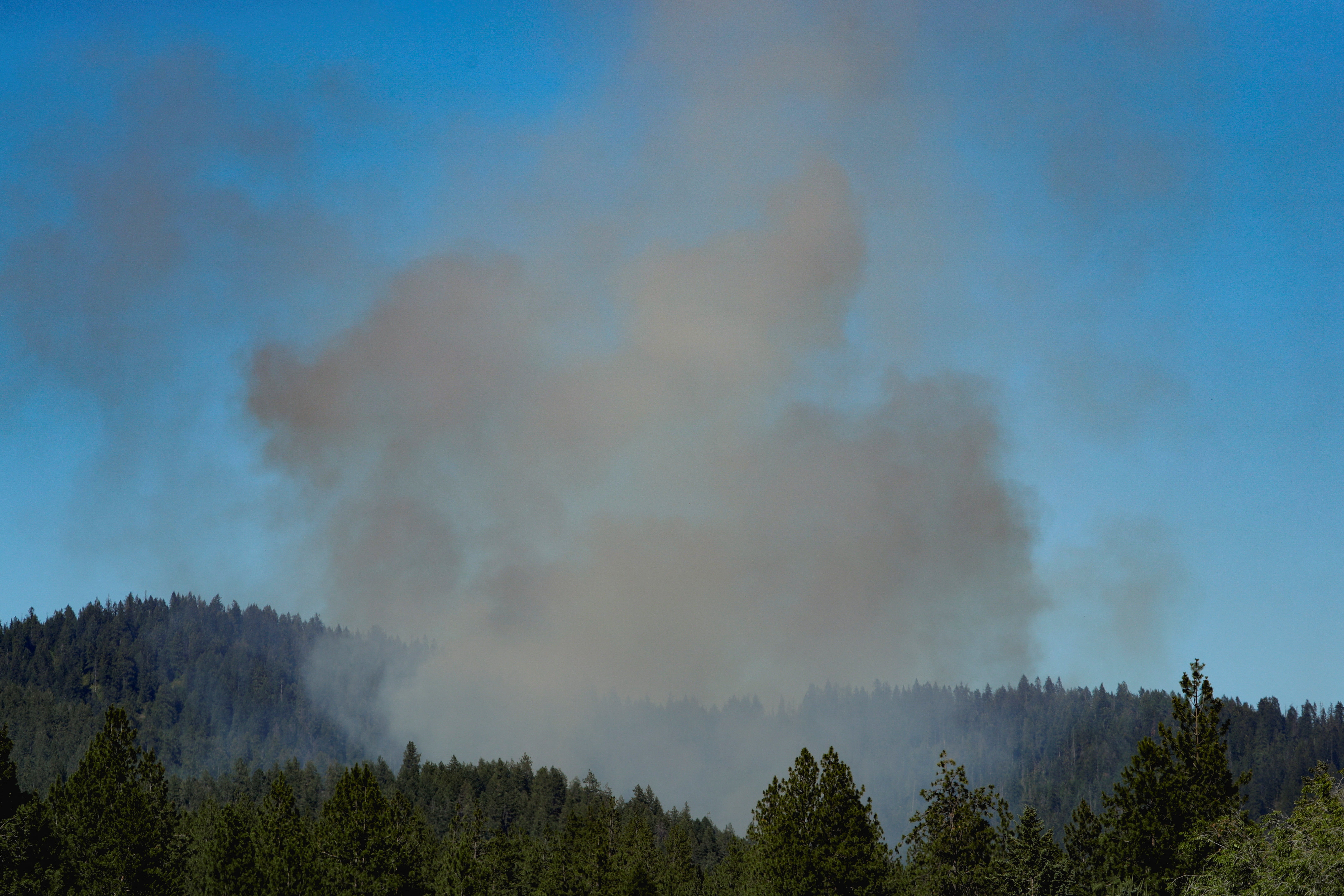 Shooting has delayed response to brush fire on Canfield Mountain, police said