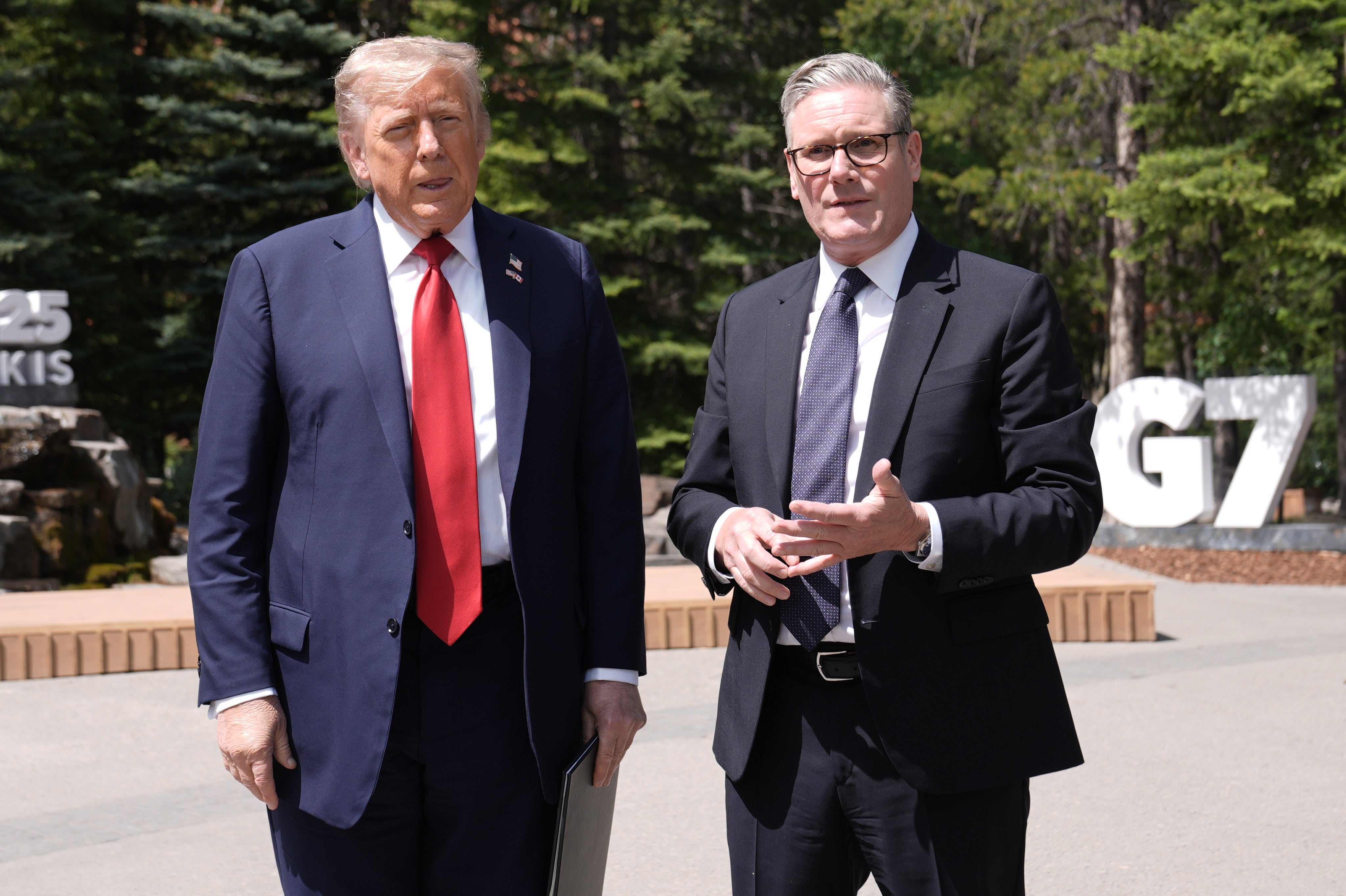 US president Donald Trump, left, and prime minister Sir Keir Starmer speaking to the media at the G7 summit in Canada