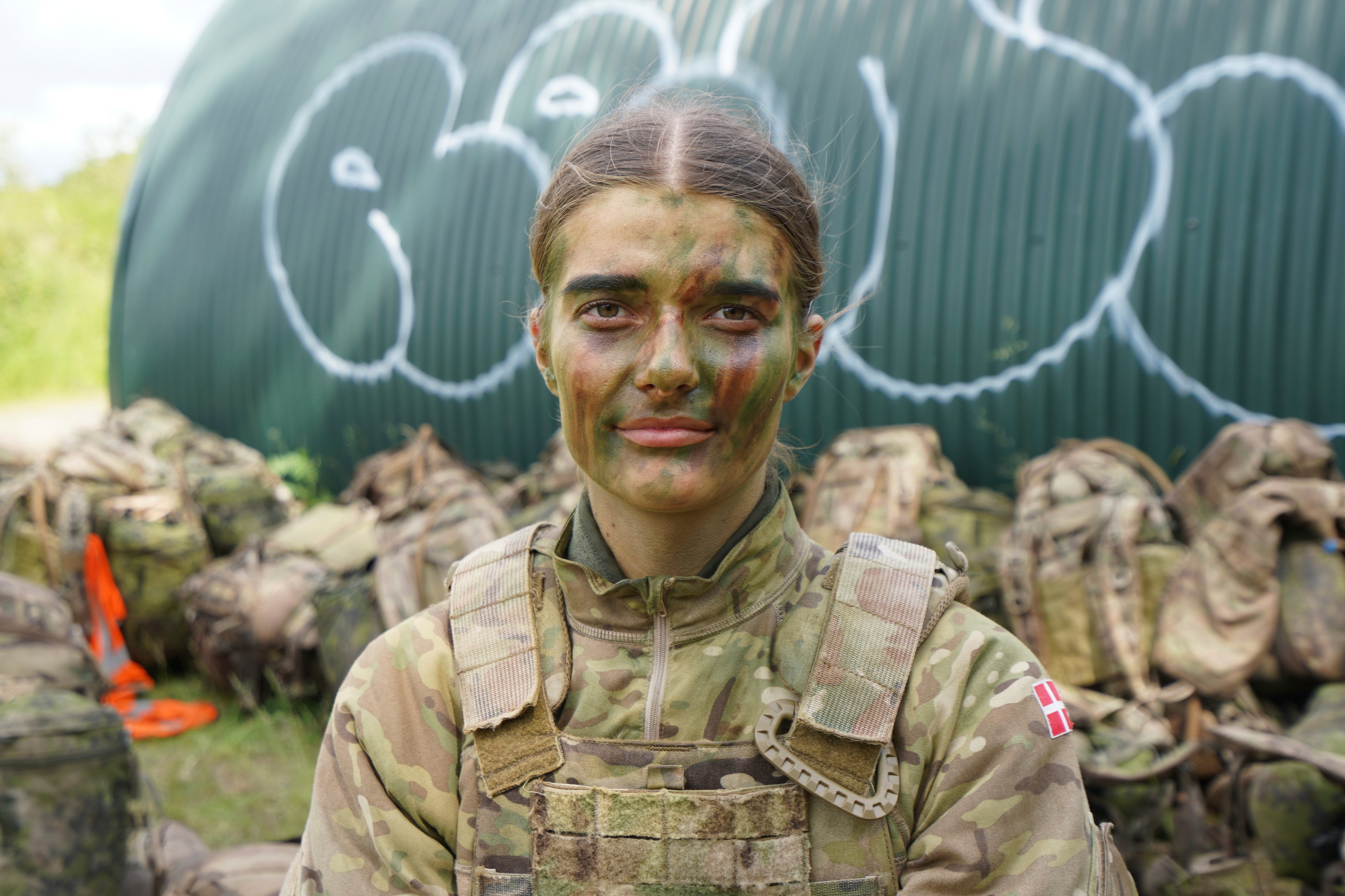 21-year-old conscript Anne Sofie poses for a photo during final exercises at a training area close to Royal Danish Army’s barracks in Hovelte, 25 kilometres north of Copenhagen, Denmark, Wednesday, June 11, 2025