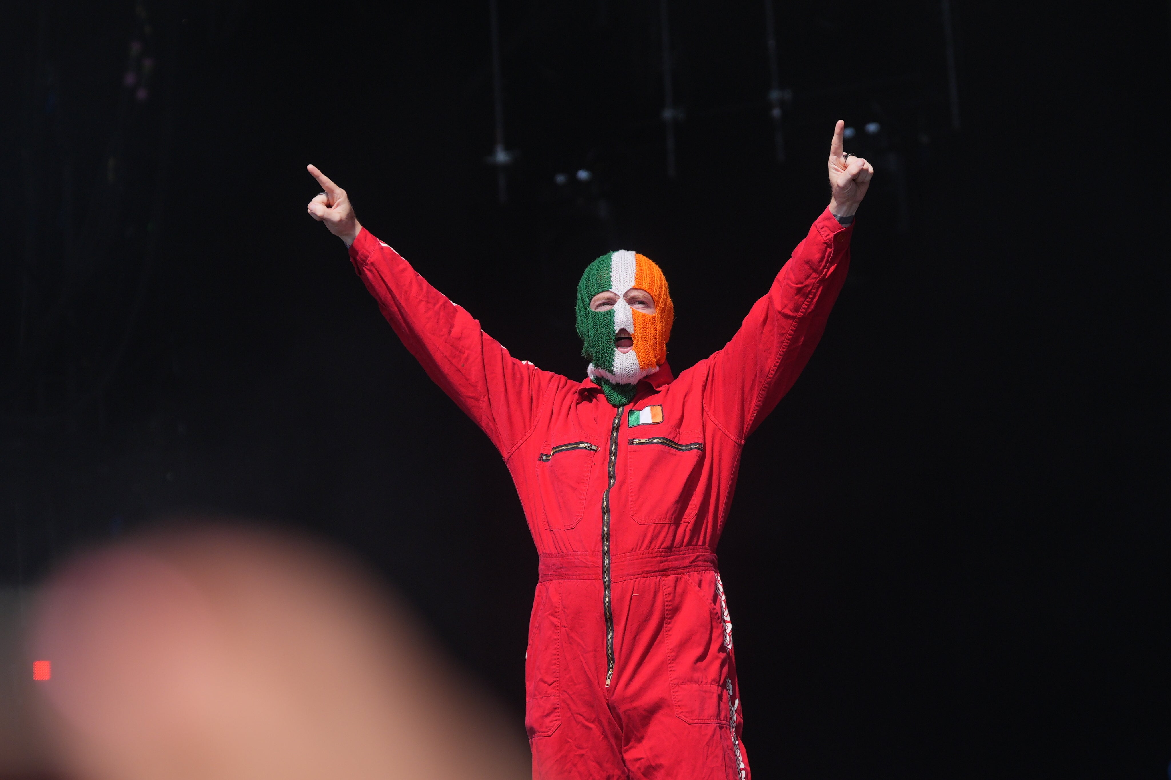 A member of Belfast rap trio Kneecap, who performed on the West Holts stage after Bob Vylan