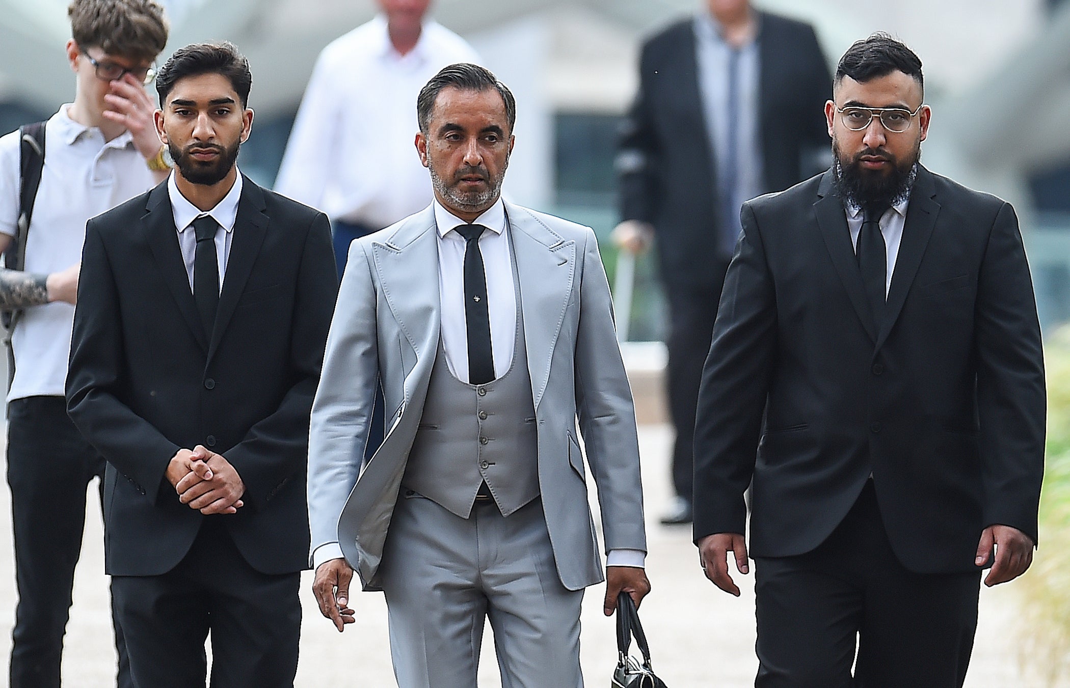 From left: Mohammed Fahir Amaaz, lawyer Aamer Anwar and Muhammad Amaad arrive at Liverpool Crown Court on Friday