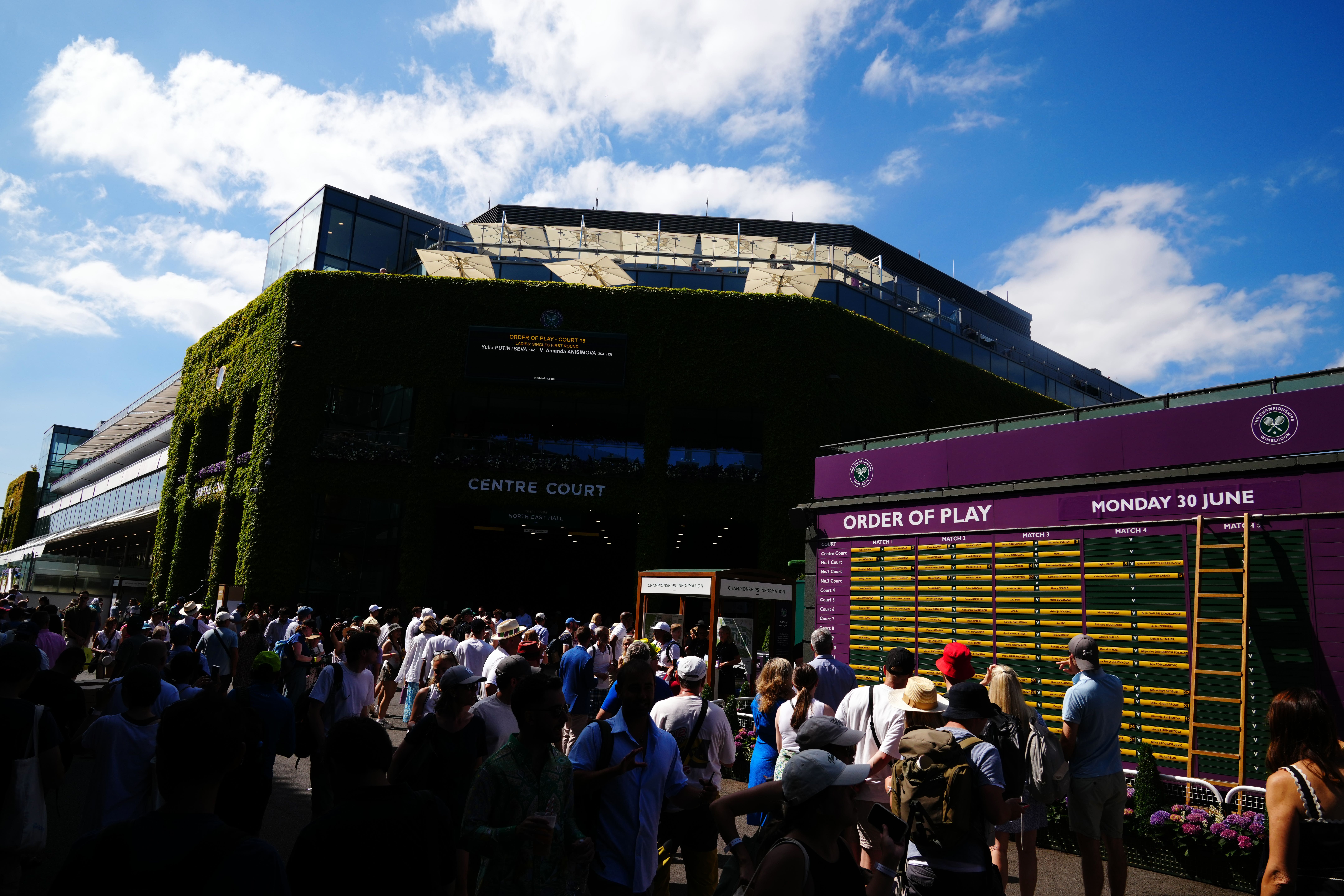 Sunny skies greeted the first fans through the gates at Wimbledon (John Walton/PA)