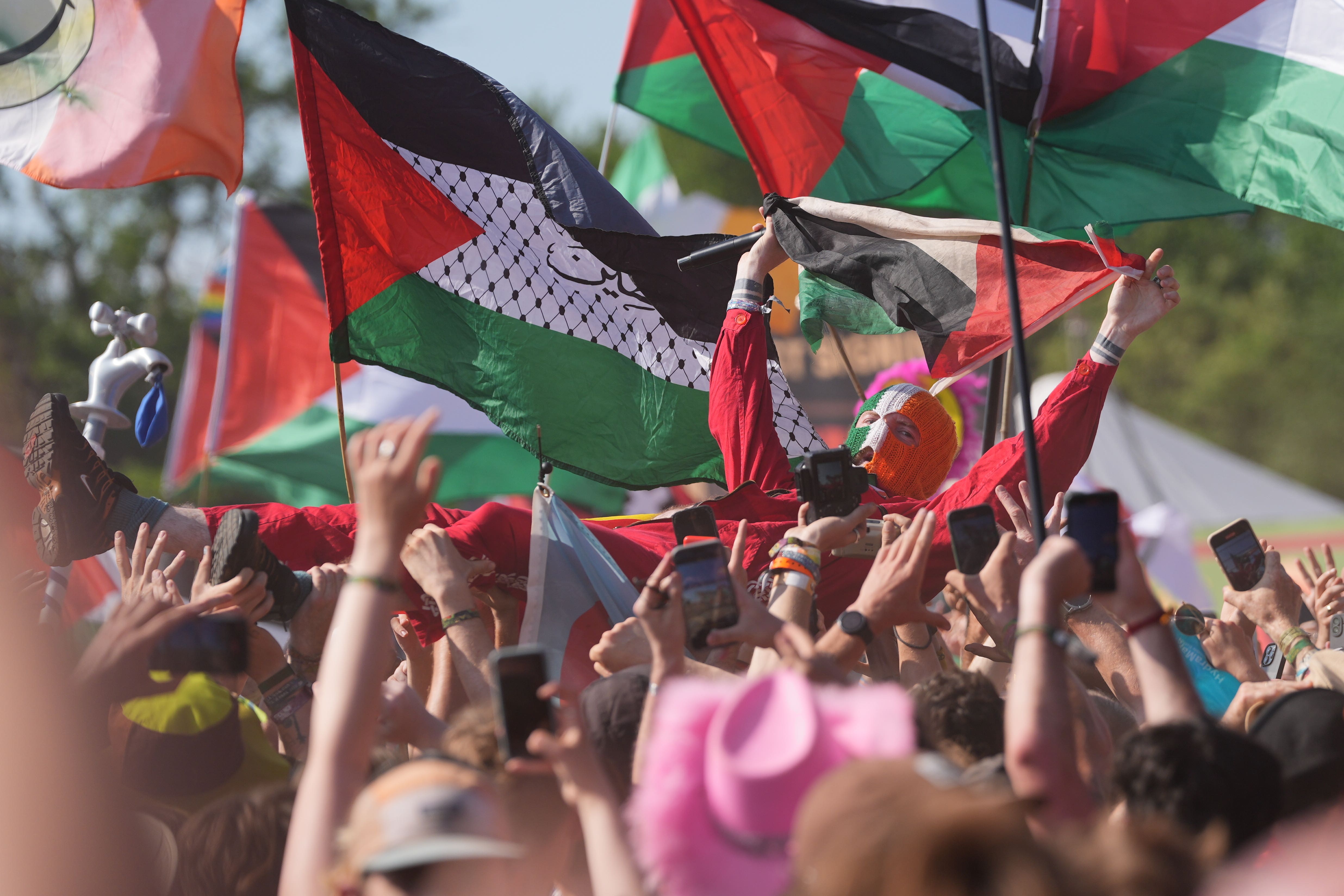 Politics was at the heart of Kneecap’s performance at the West Holts Stage on Saturday (Yui Mok/PA)