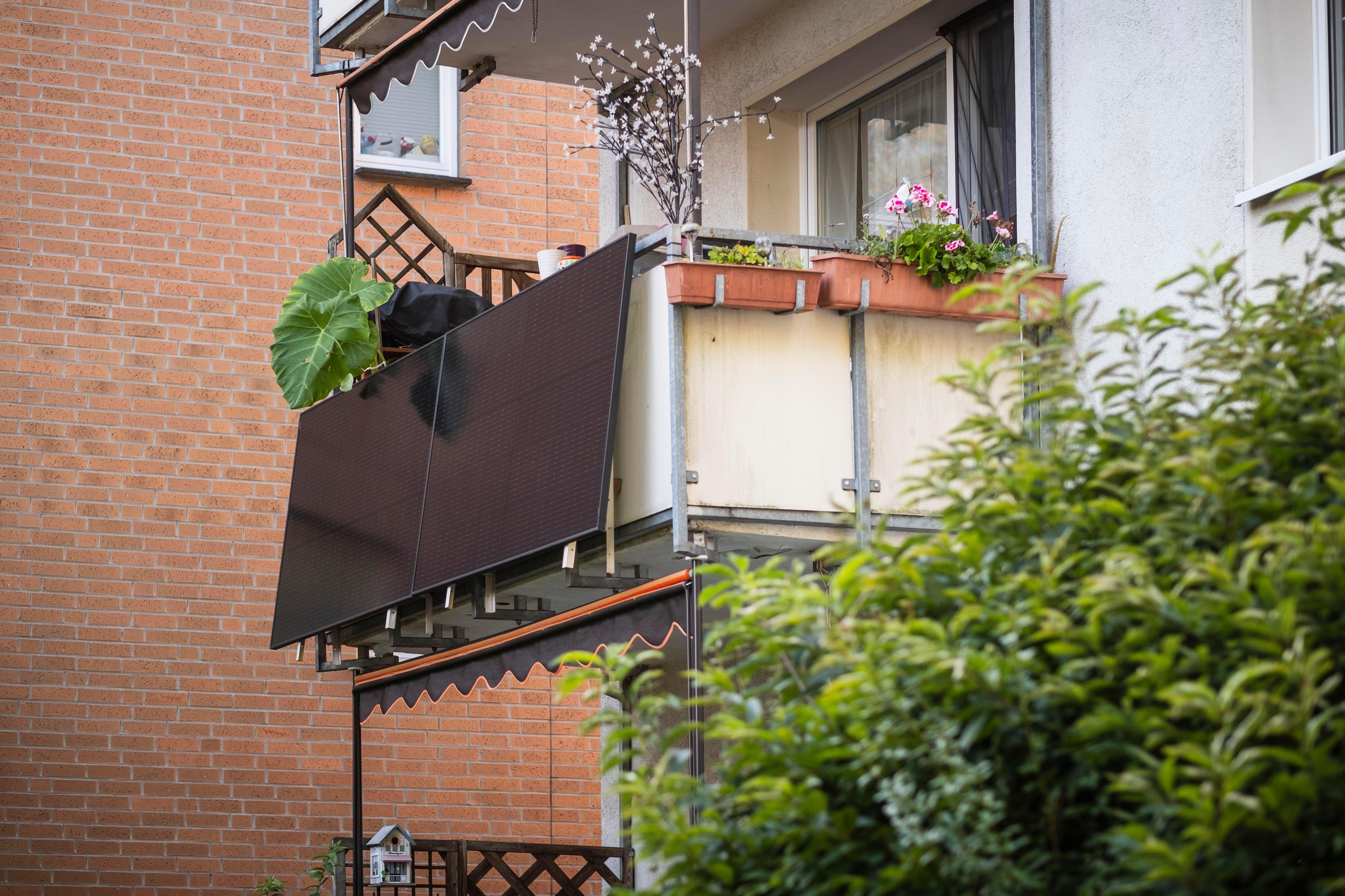 Balcony solar panels on an apartment balcony in Germany (Alamy/PA)