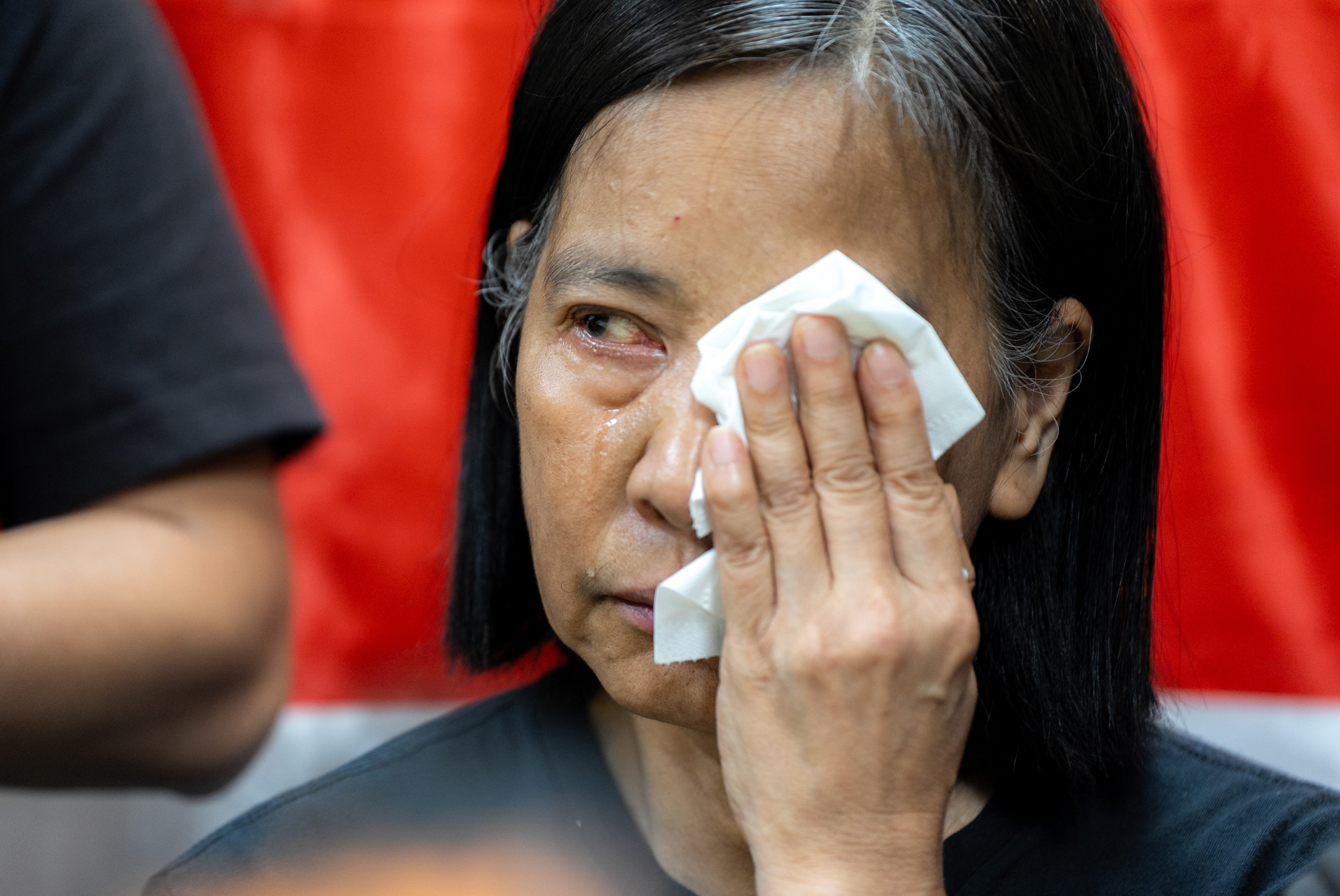 Chan Po Ying, chair of the League of Social Democrats, reacts during a press conference on Sunday