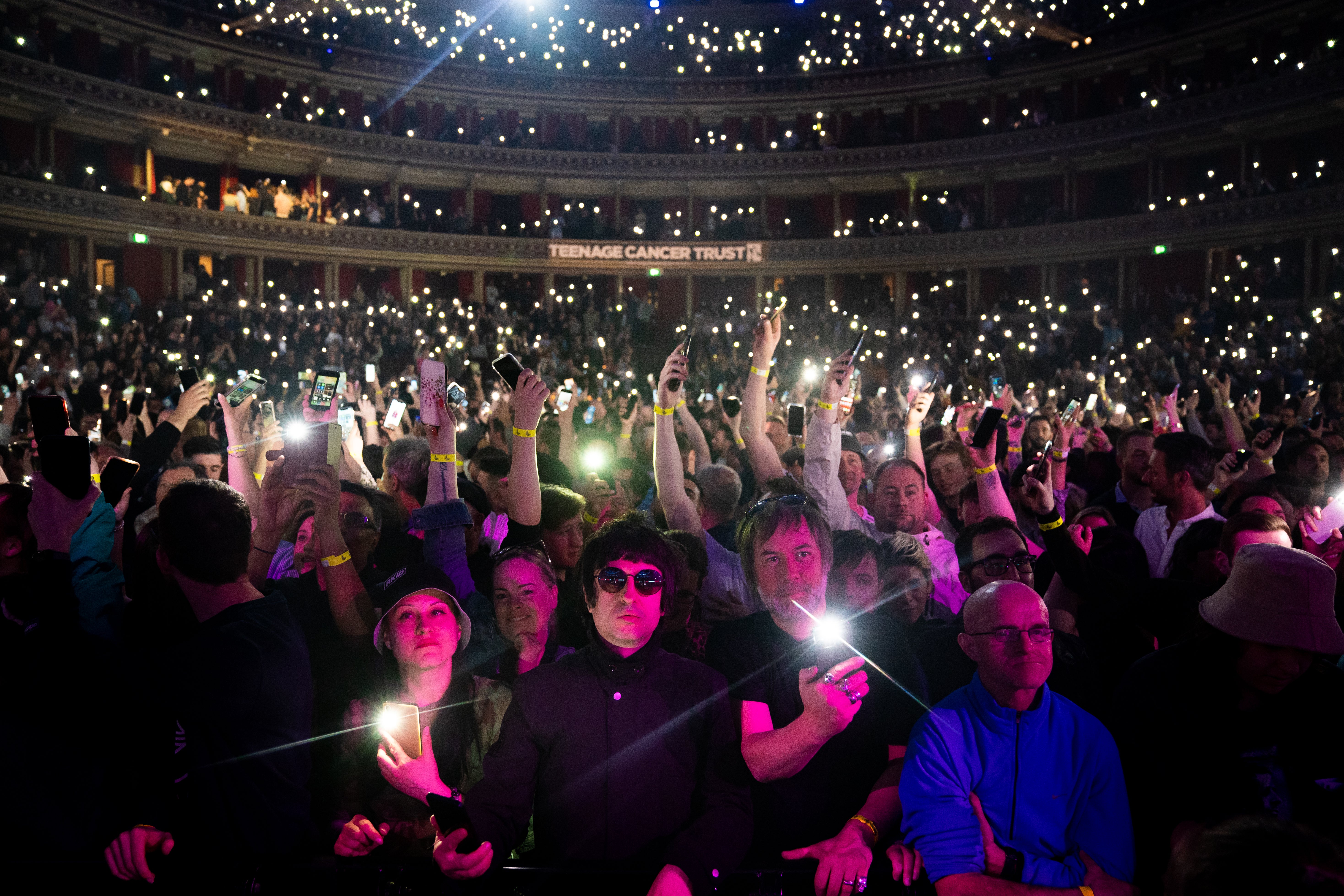 Fans watch Liam Gallagher perform on stage during the Teenage Cancer Trust Concert, at the Royal Albert Hall, London in 2022