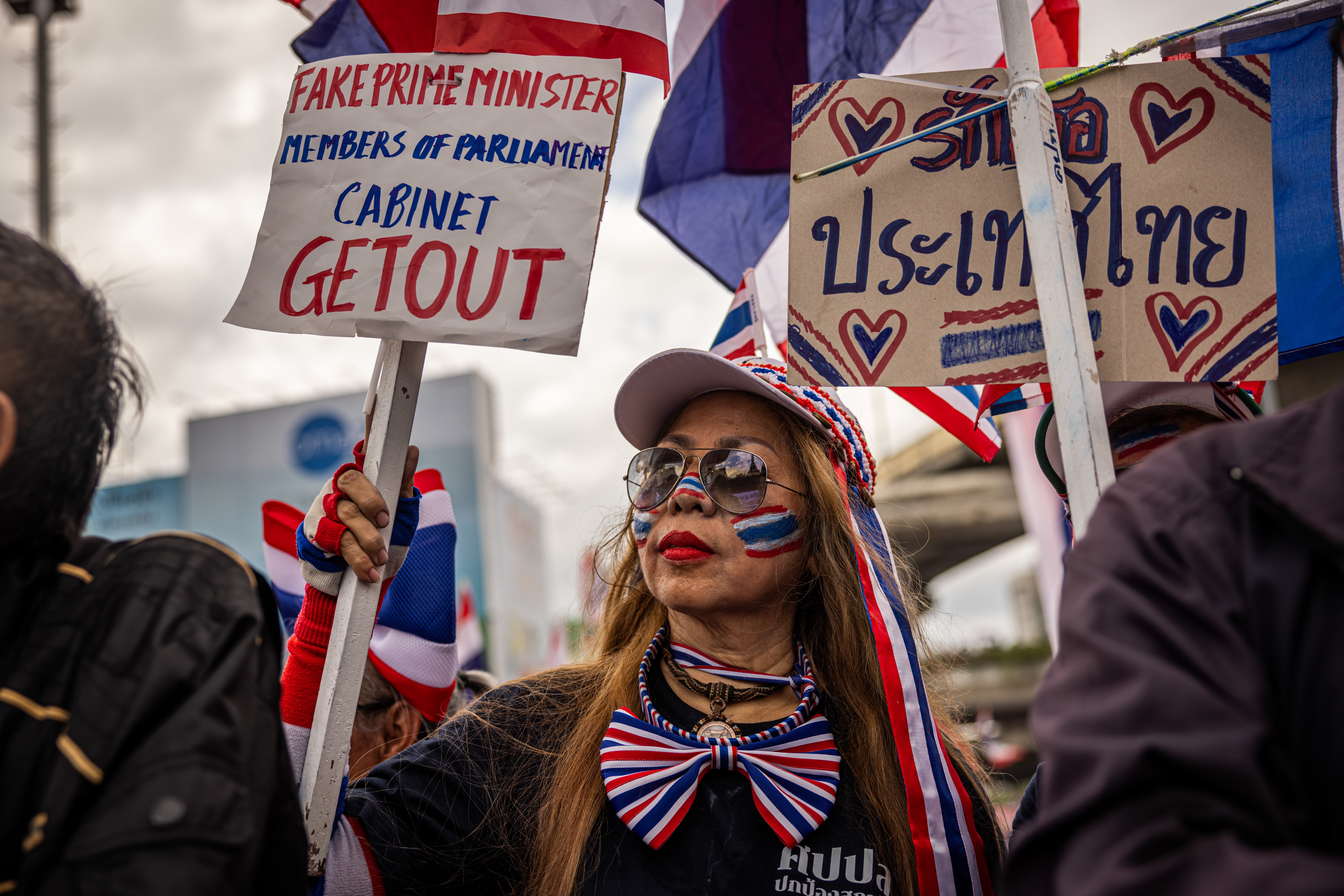 Protesters rally in front of Victory Monument on 28 June 2025 in Bangkok, Thailand. Thousands of protesters gathered at Bangkok's Victory Monument to demand prime minister Paetongtarn Shinawatra resign over a leaked phone call linked to a border dispute with Cambodia