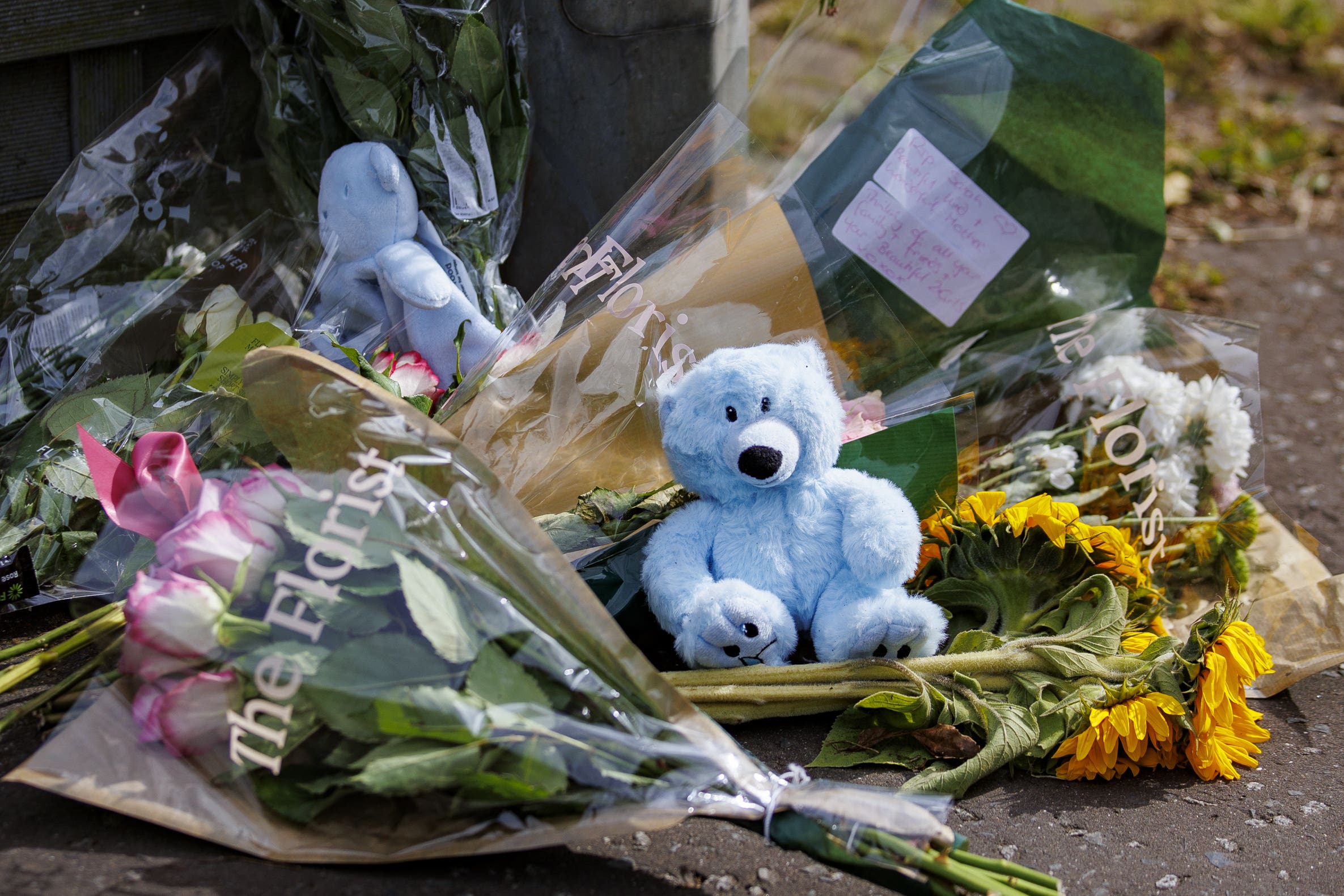 Floral tributes and teddy bears placed in Elmfield Walk area of Donaghadee, Co Down (Liam McBurney/PA)
