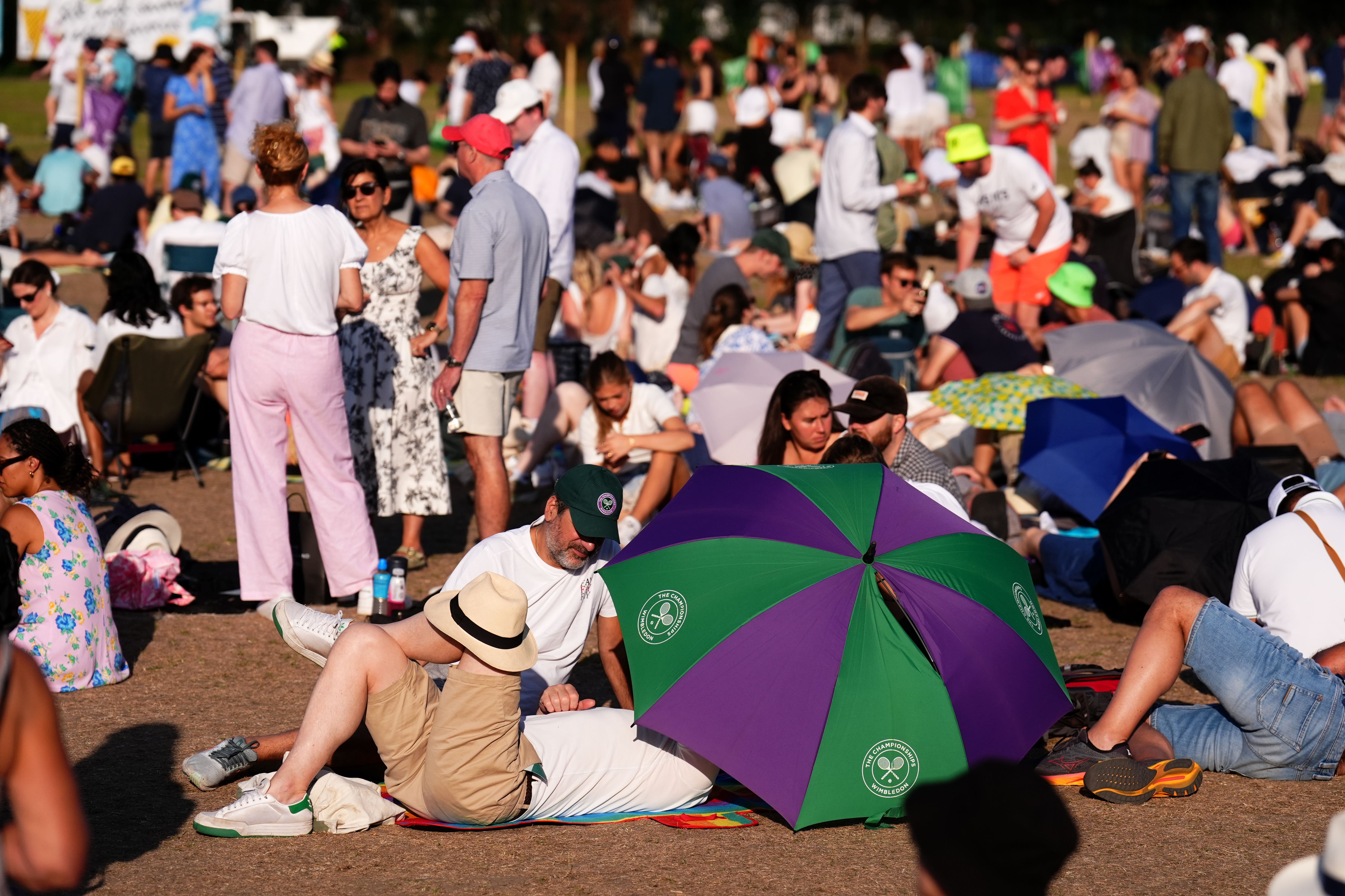 Spectators in the queue on day two of the 2025 Wimbledon Championships (Mike Egerton/PA)