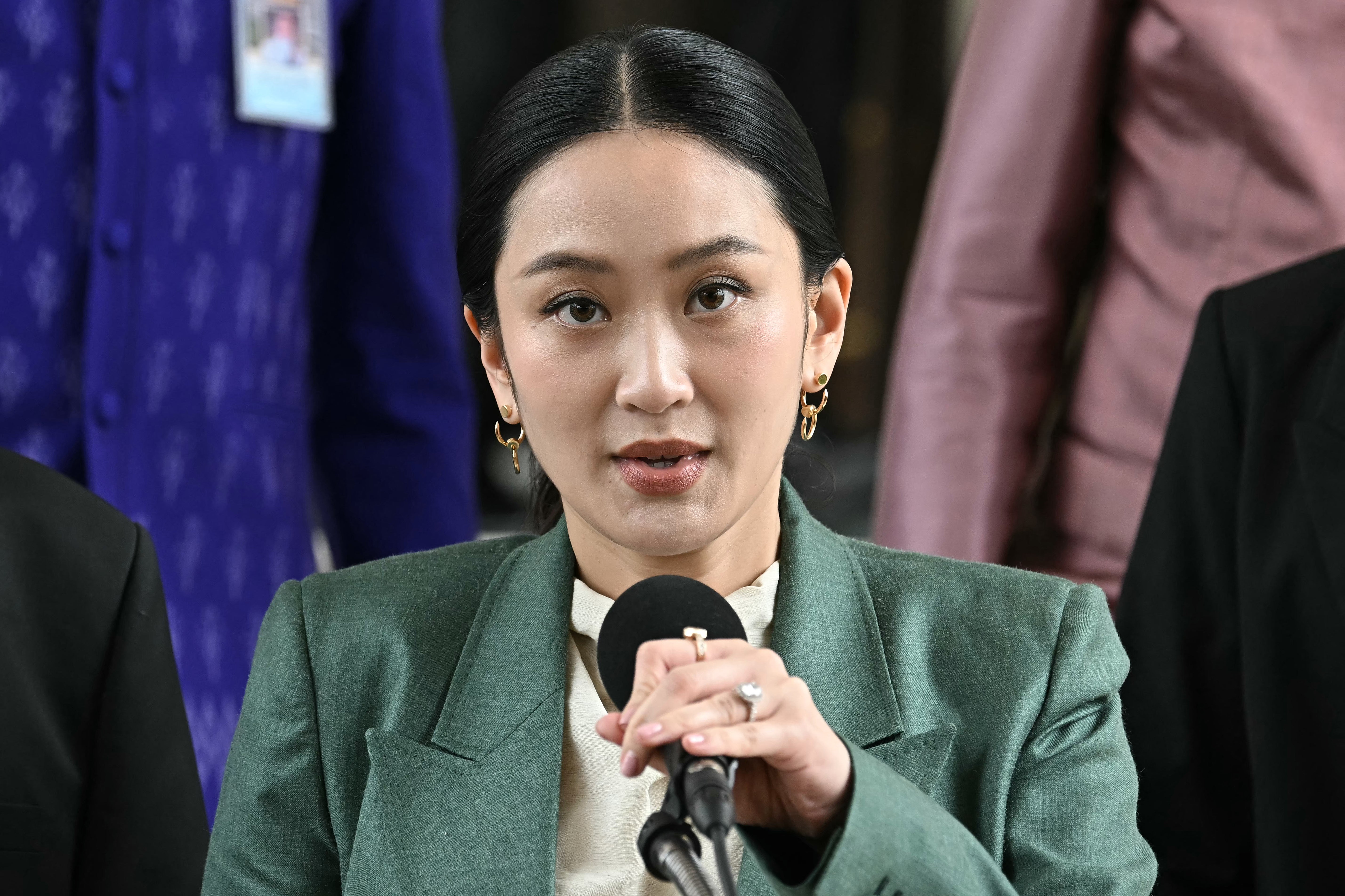 Paetongtarn Shinawatra arrives for a press conference following her suspension in July