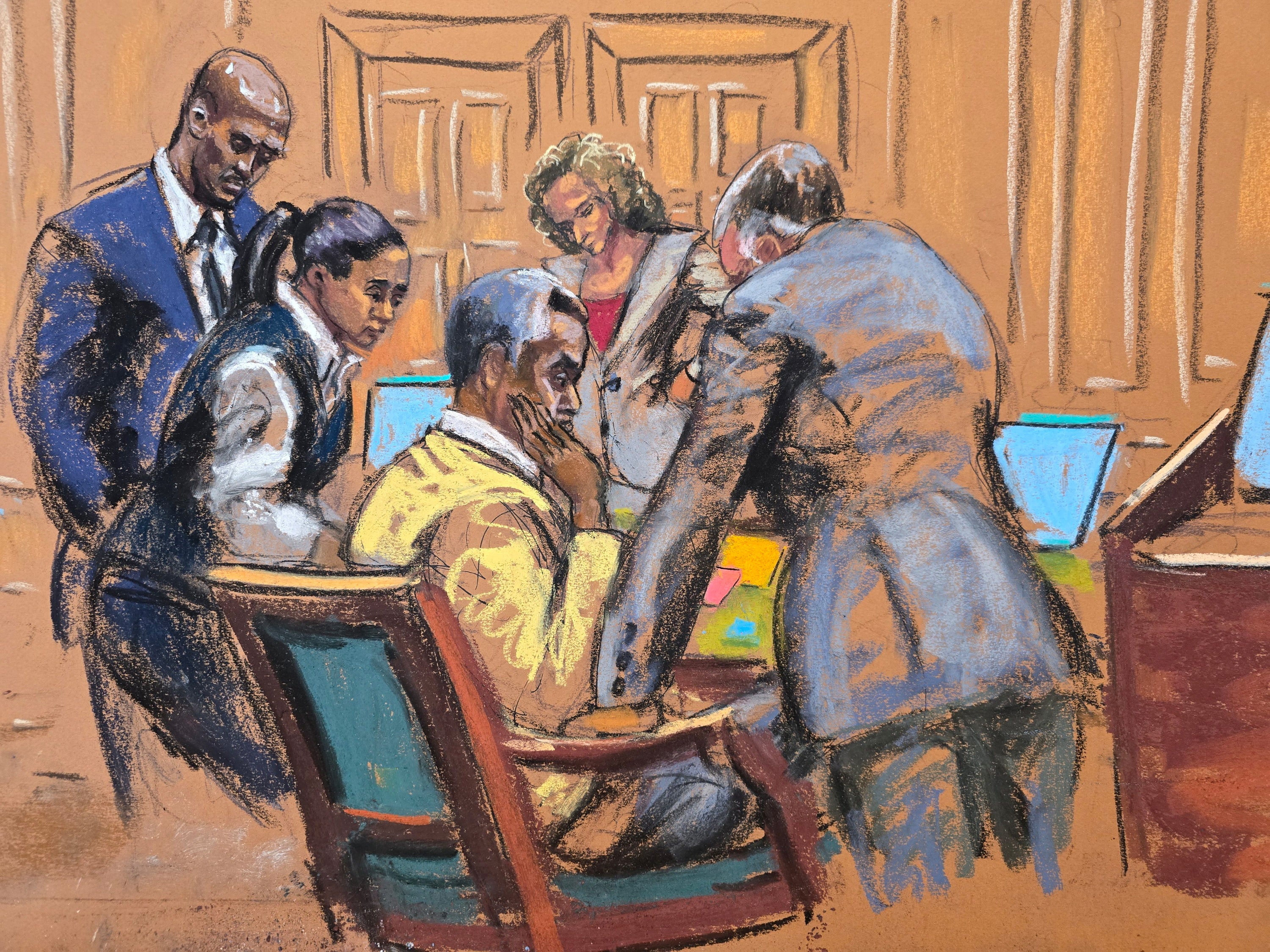 Defense attorneys discuss with Combs how to respond to a note sent by jurors