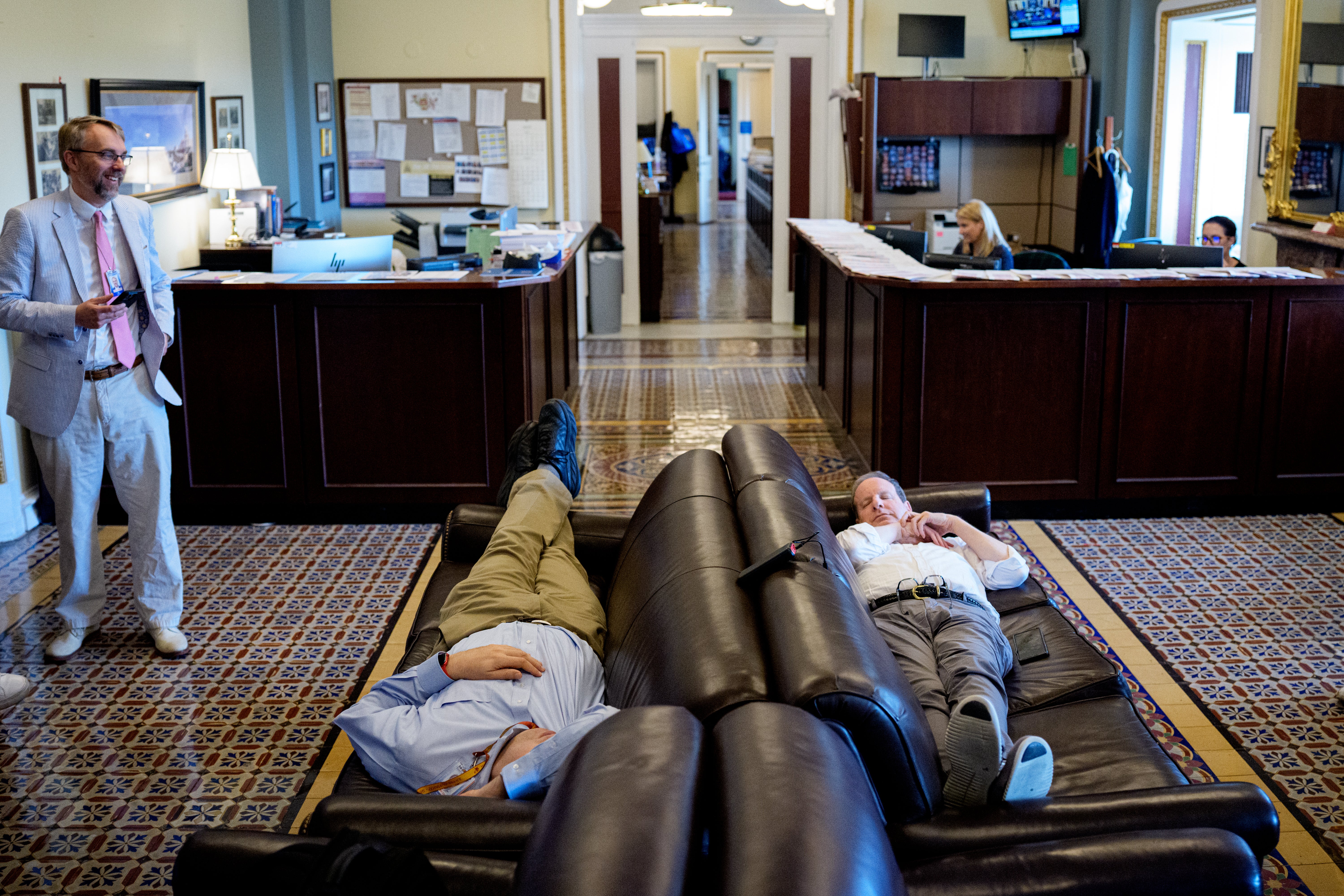 Reporters taking the opportunity for a catnap in the Press Gallery off the Senate Chamber as the Senate stayed in session throughout the night at the U.S. Capitol Building on July 1, 2025.