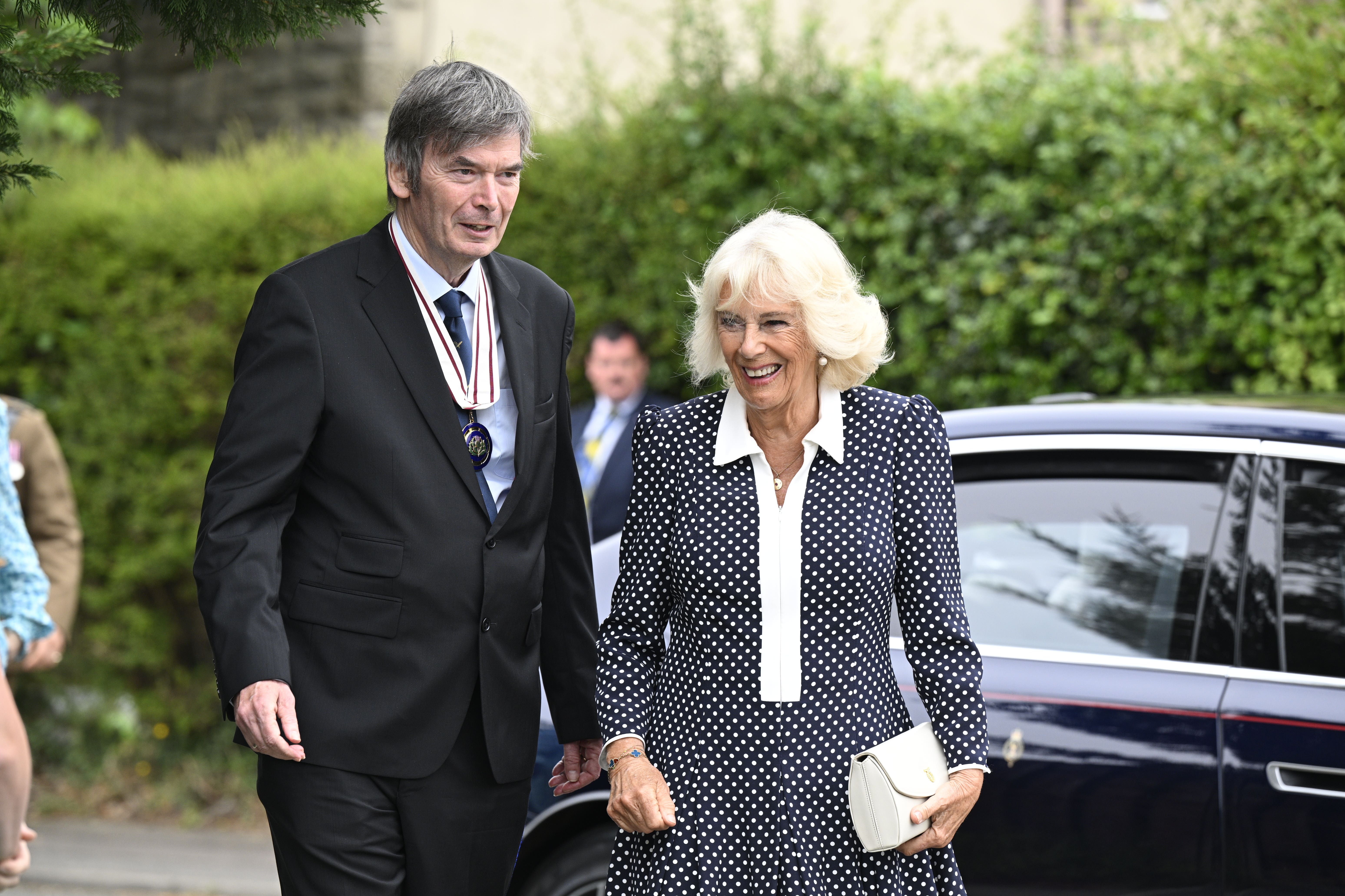 The Queen was greeted by Sir Ian Rankin at Ratho Library in Newbridge, Edinburgh (PA)