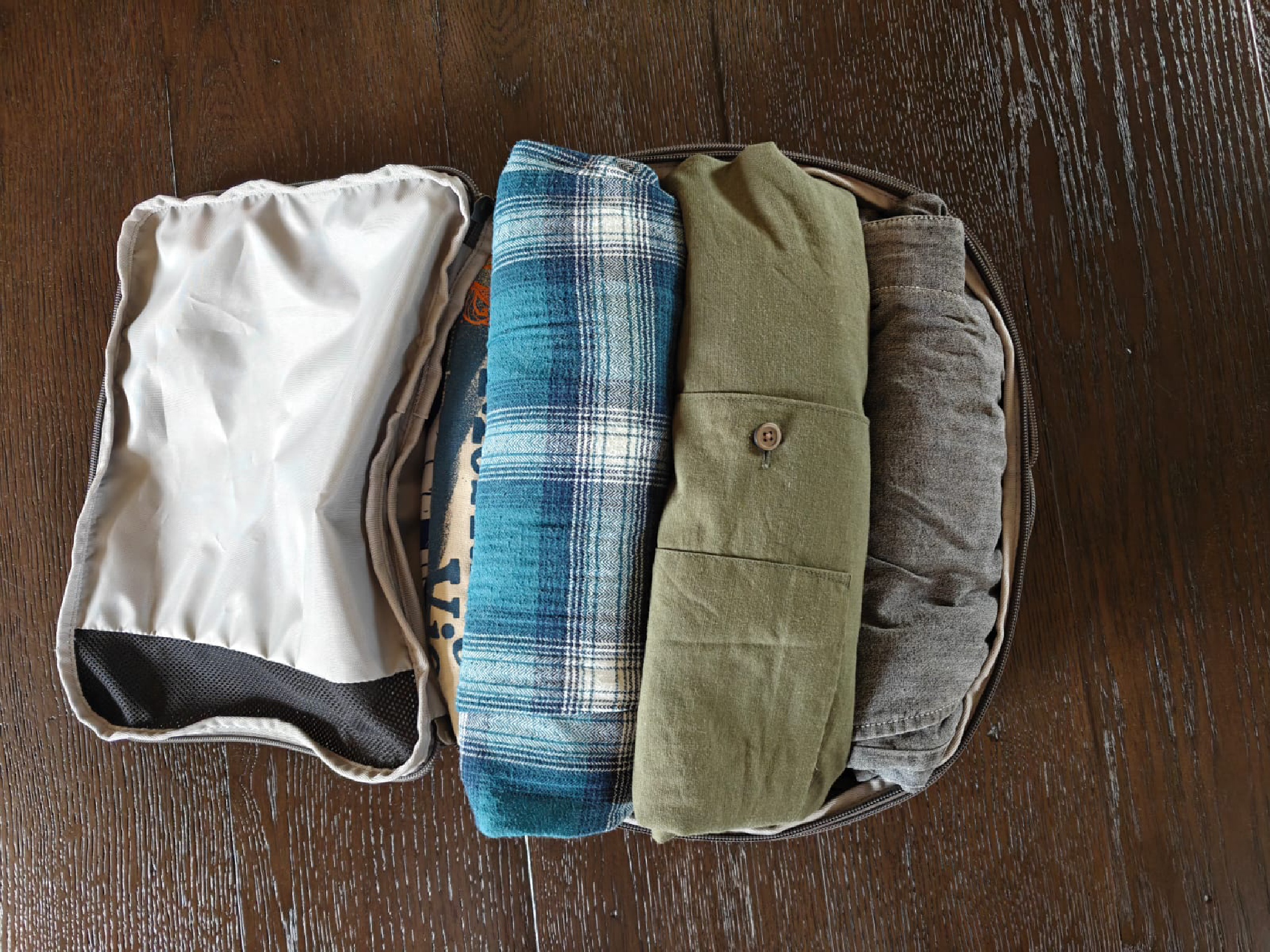 Testing one of the packing cubes with folded shirts