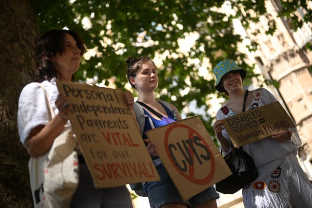 <p>Prostesters against the proposed reforms to the welfare state in central London on Tuesday</p>
