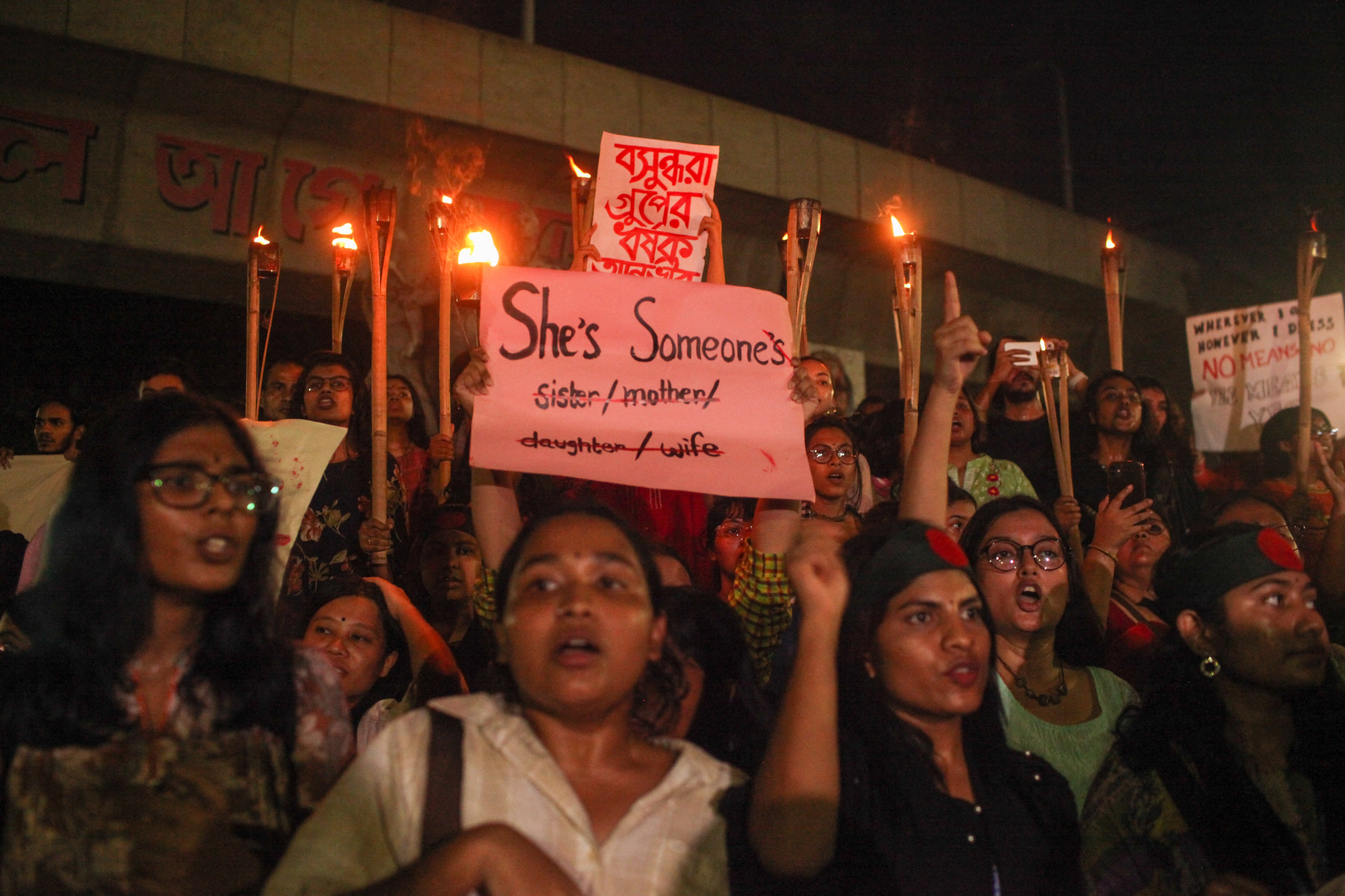 Bangladeshi women march through the streets while holding a candlelight in a protest against rape in Dhaka, Bangladesh, on 16 August 2024