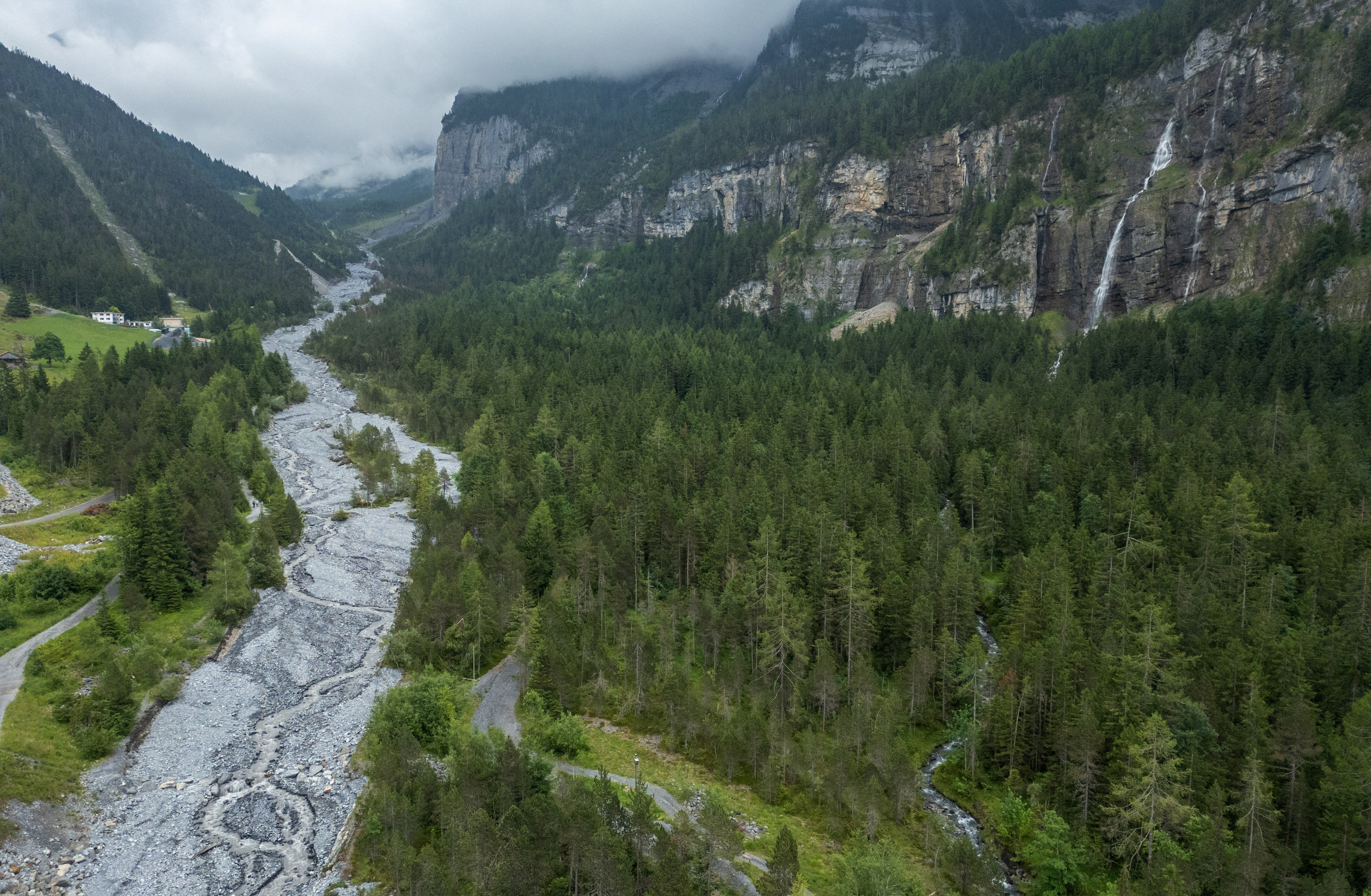 A drone view shows the Oeschiwand (Oeschi Wall) in the Oeschibach River, protecting the village from flash floods and rock falls from Spitzen Stein at Oeschinensee, as climate change and warming permafrost pose increasing challenges in Kandersteg, Switzerland, June 26, 2025