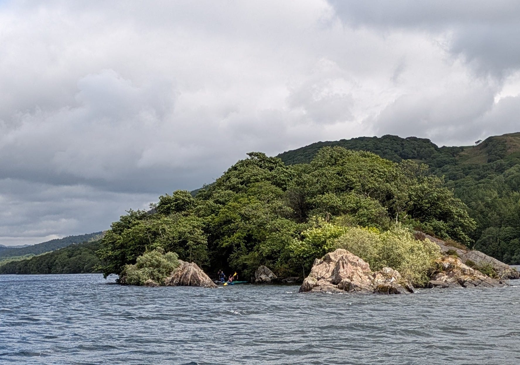 Kayakers around Peel Island in the Lake District
