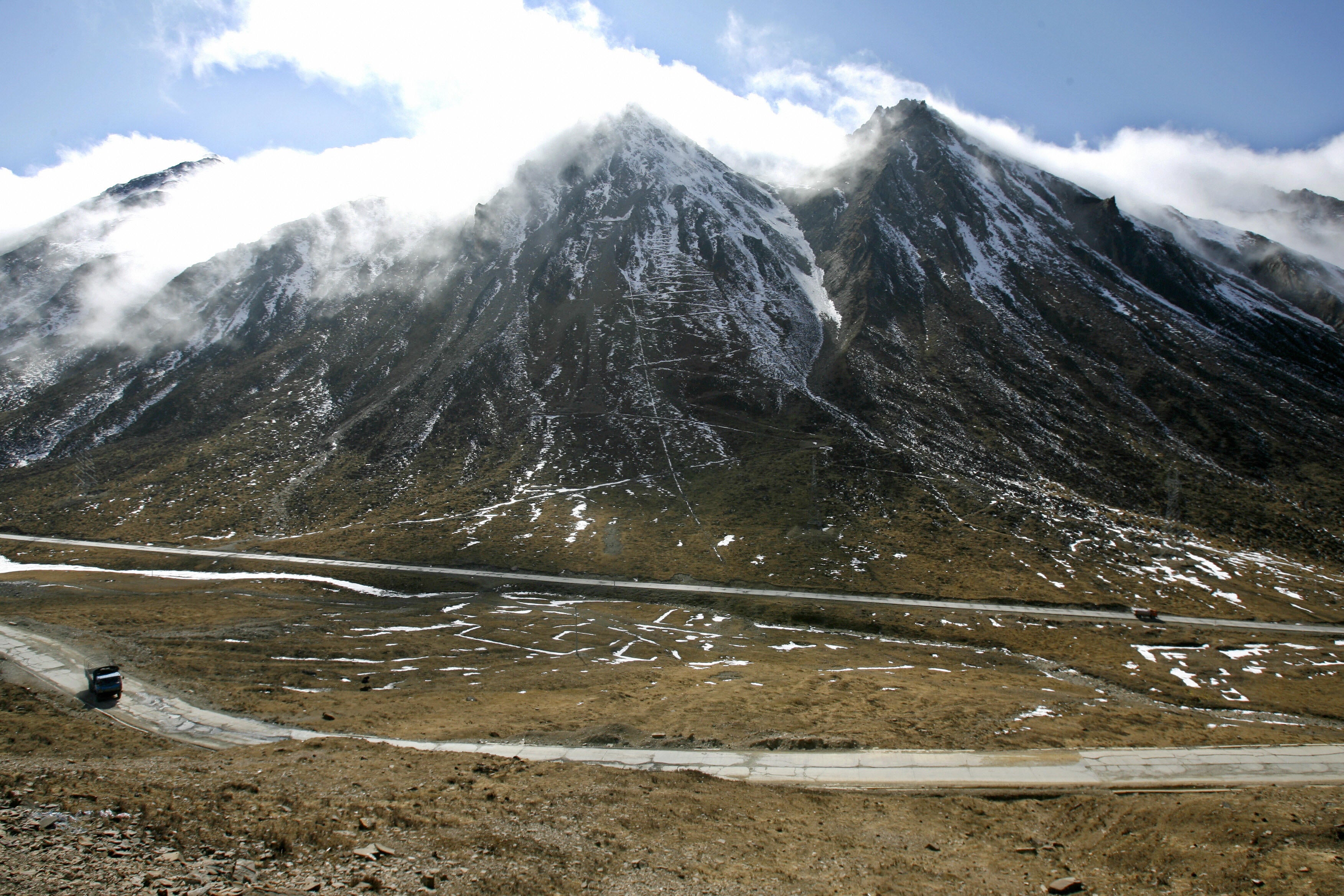 File. A truck passes along a road connecting to Mount Siguniang in China’s southwestern Sichuan province