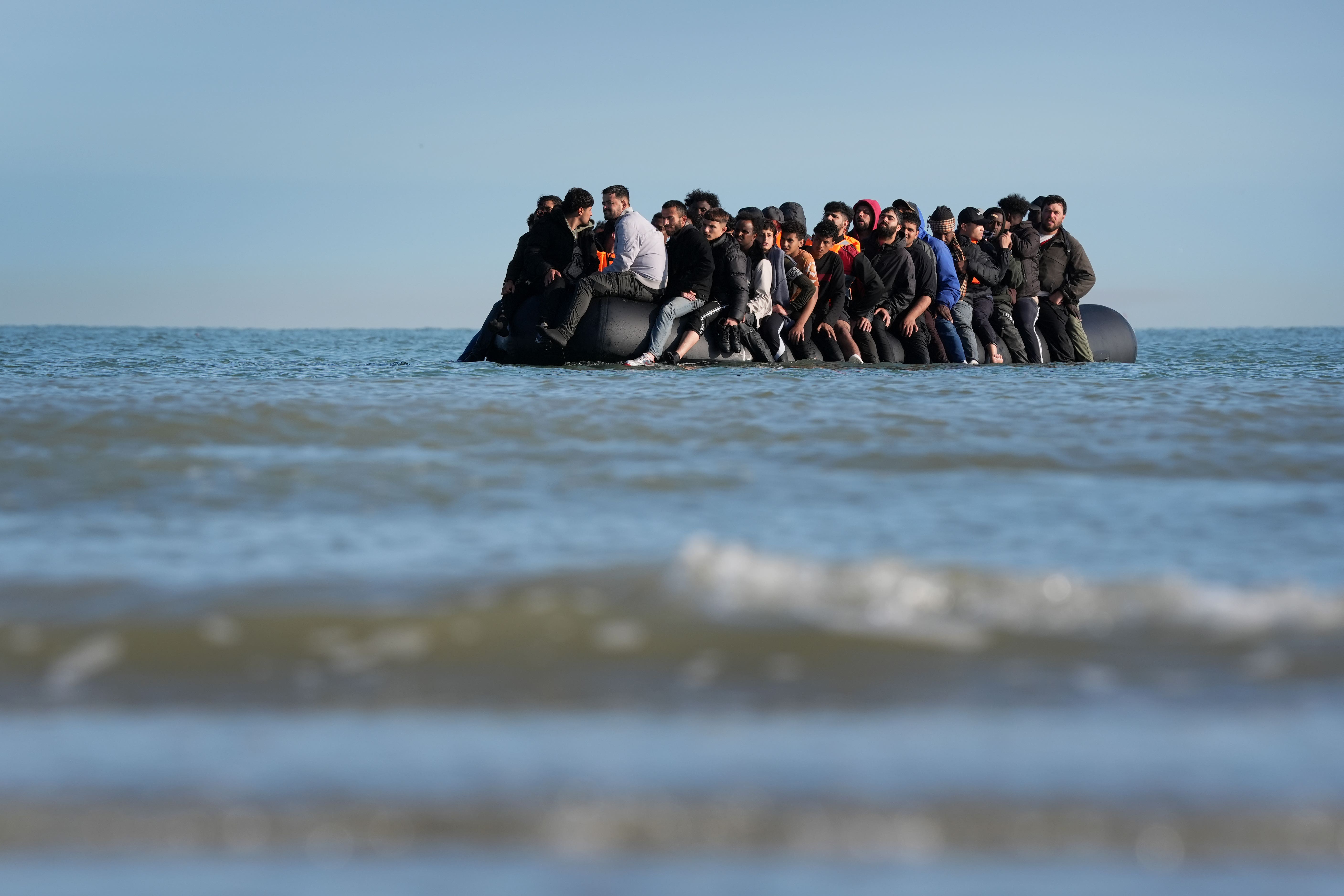A group of people thought to be migrants on a dinghy (Gareth Fuller/PA)