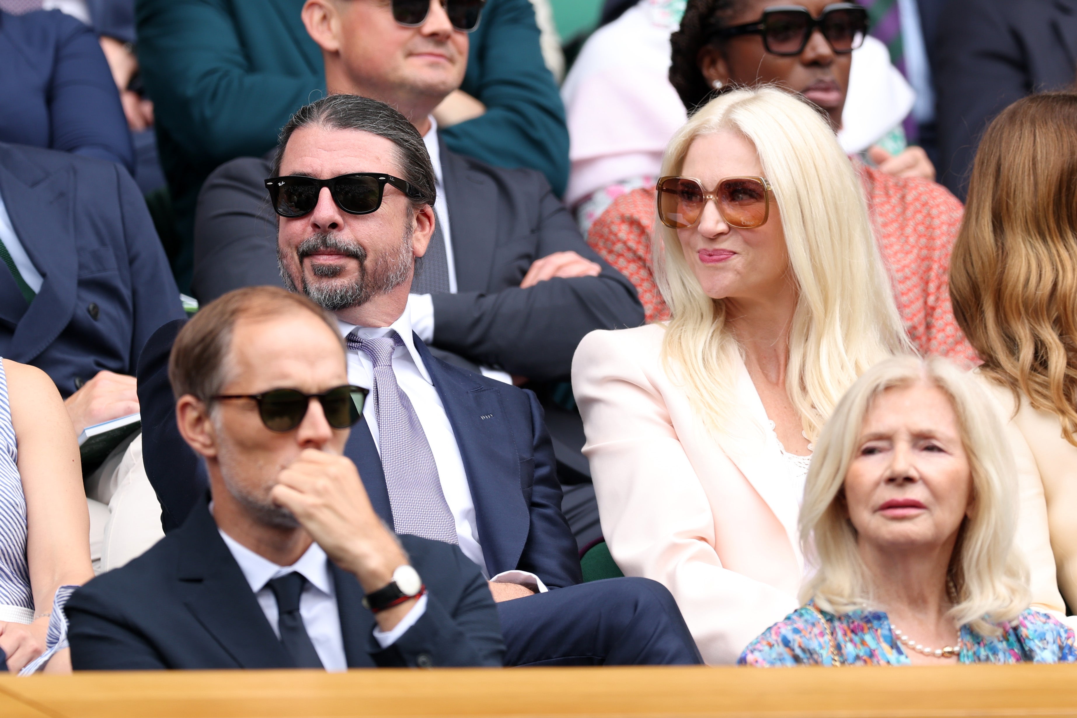 Dave Grohl and Jordyn Blum are seen in the Royal Box prior to the Ladies' Singles second round match between Aryna Sabalenka and Marie Bouzkova of Czechia on day three at Wimbledon