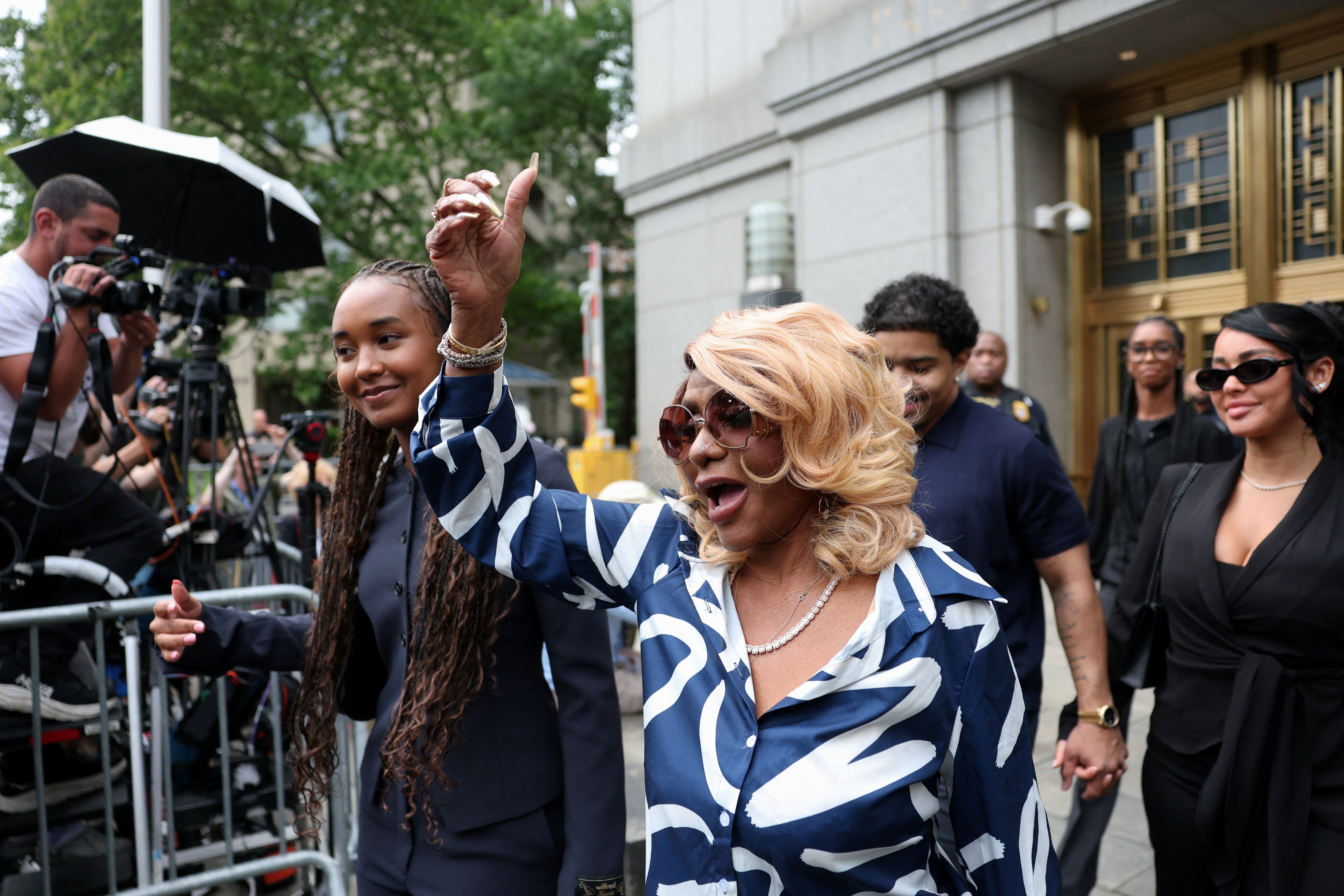 Diddy’s mom, Janice Combs, reacts as she leaves federal court after the verdict on Wednesday.