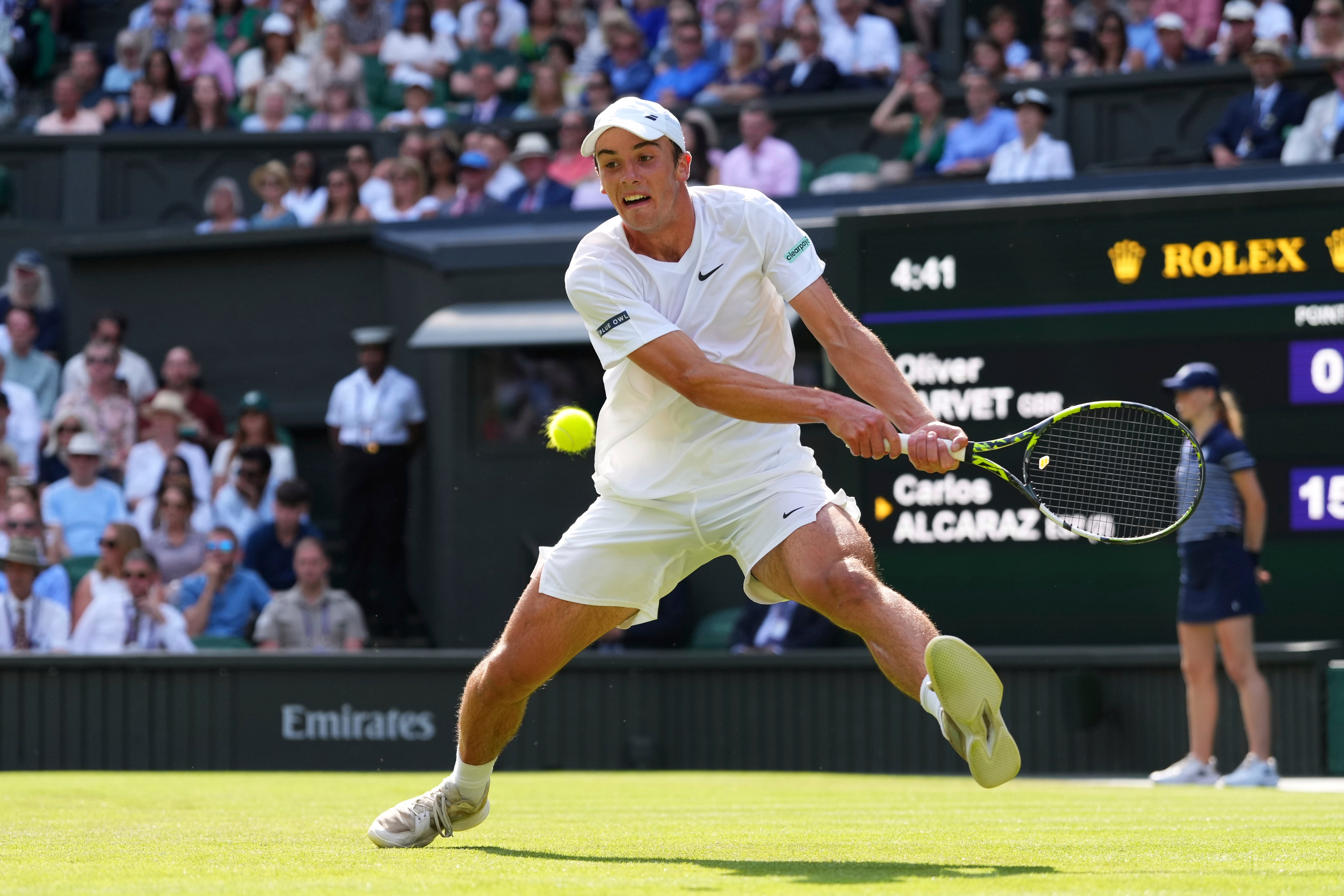 Ollie Tarvet stretches for a backhand