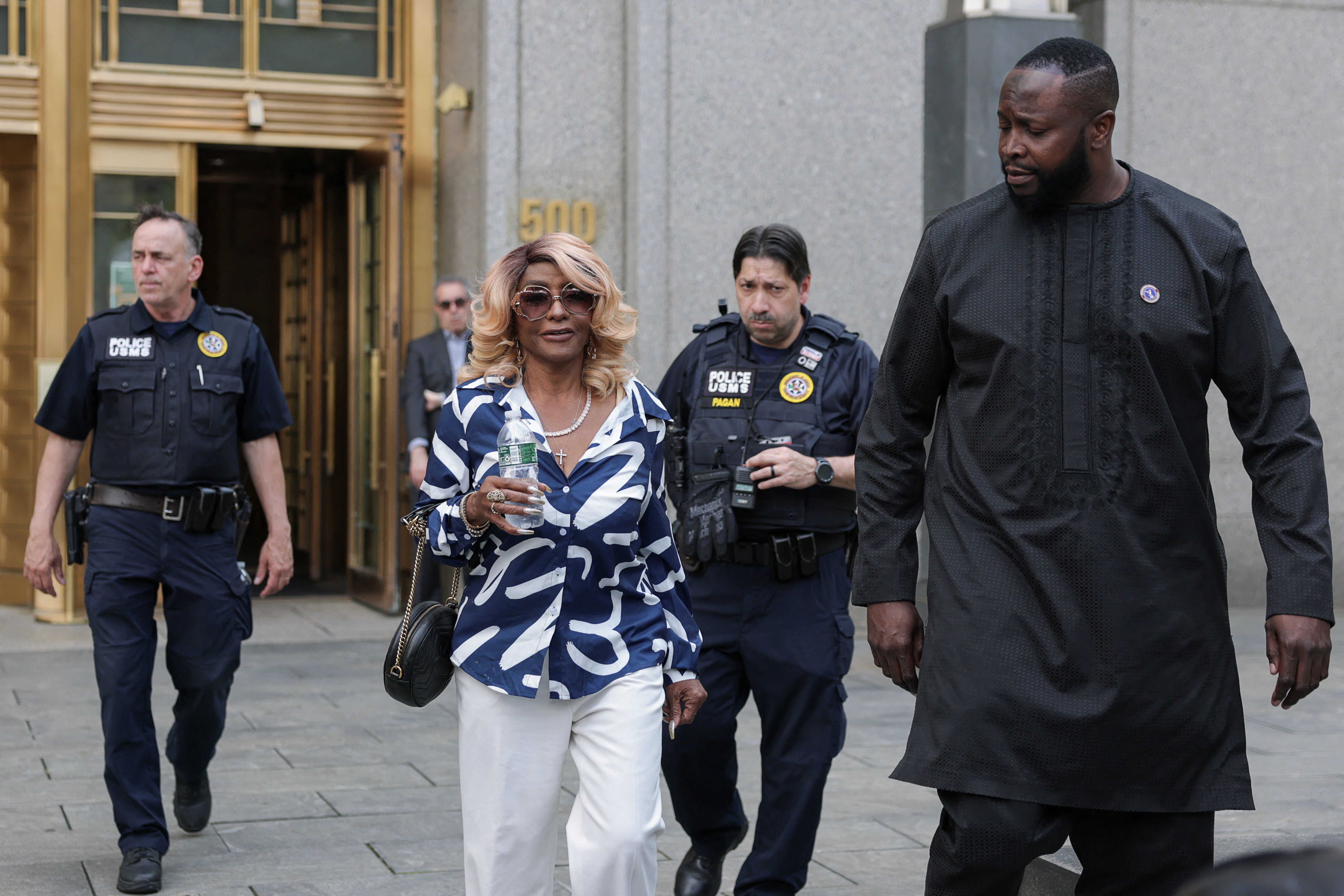 Janice Combs walks outside the U.S. federal court, after the jury reached verdicts in the Sean "Diddy" Combs
