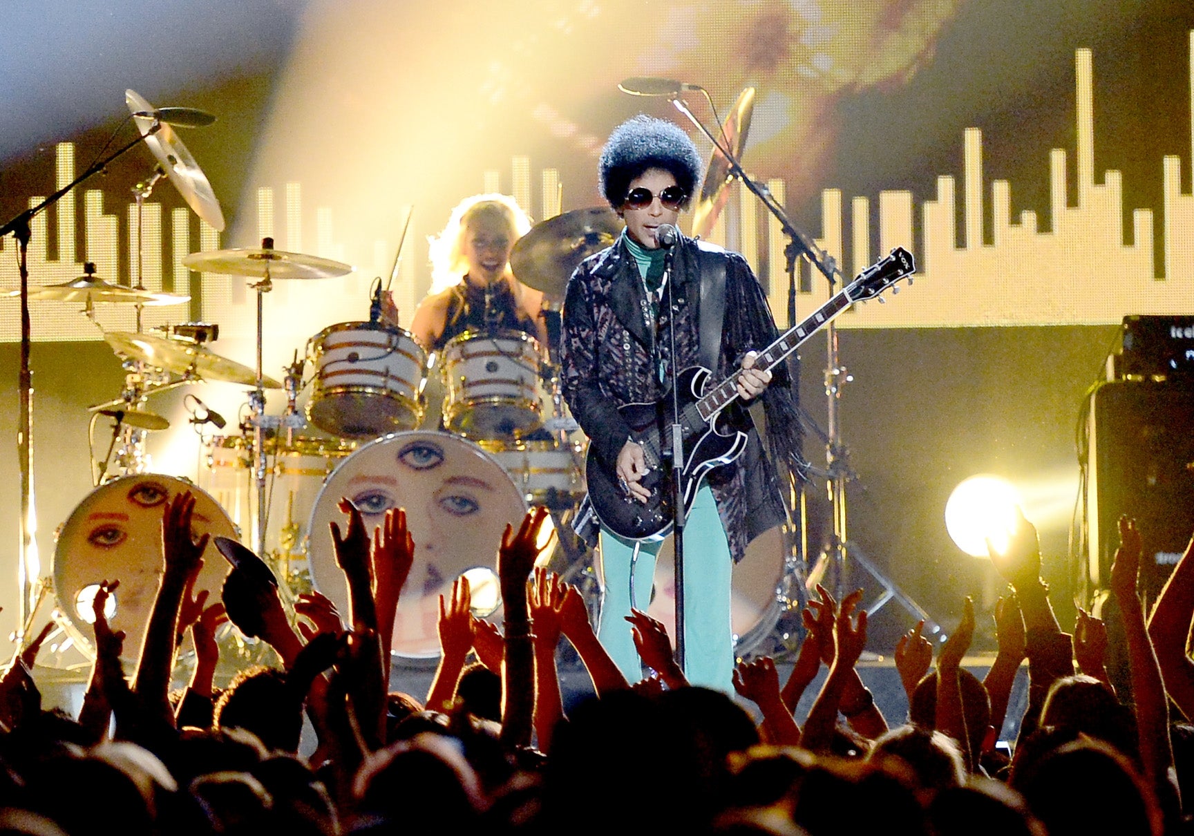 Prince performs onstage during 2013 Billboard Music Awards