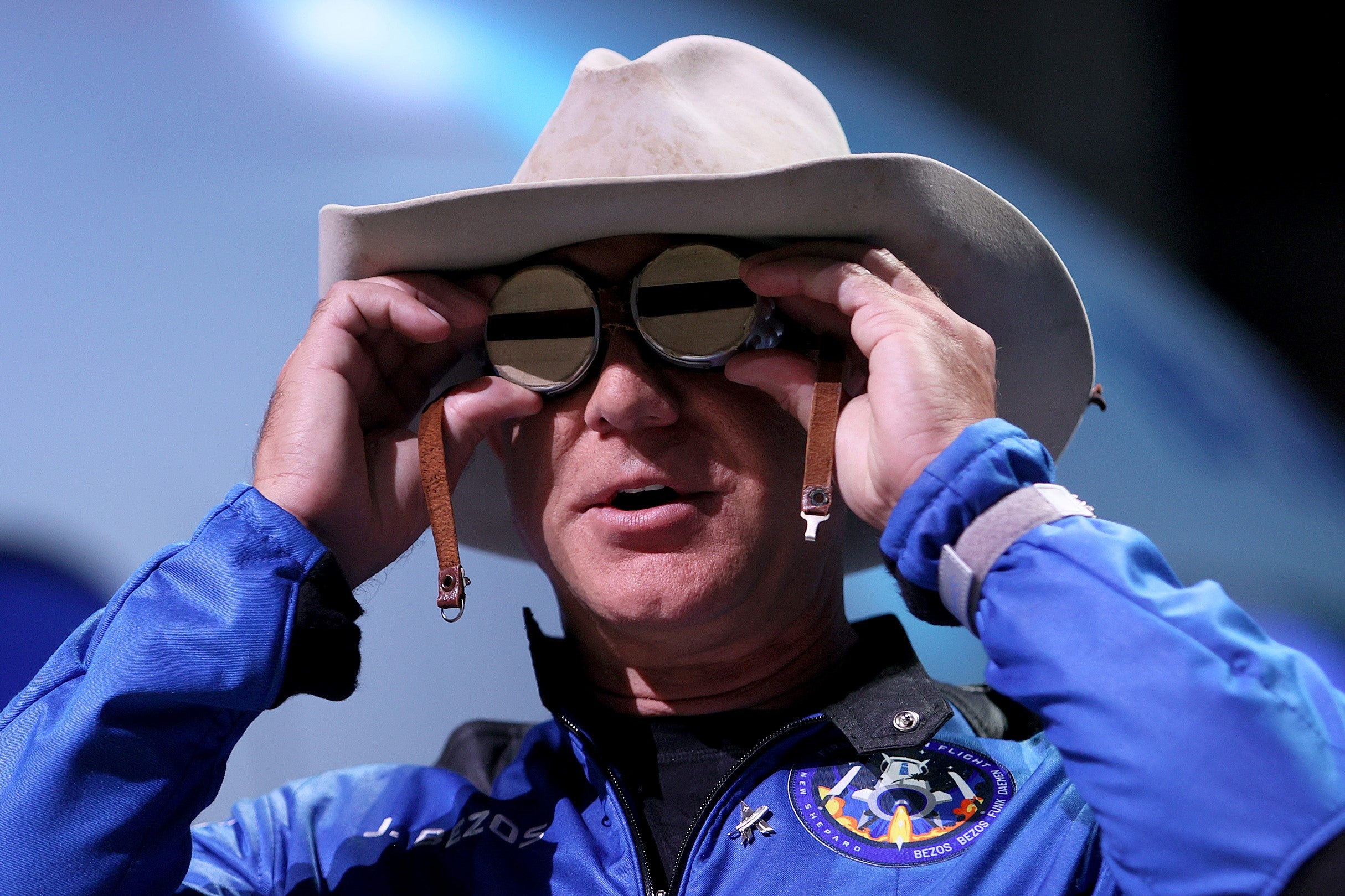 Jeff Bezos holds Amelia Earhart's aviation glasses while speaking about his flight on Blue Origin’s New Shepard rocket into space on 20 July, 2021 in Van Horn, Texas
