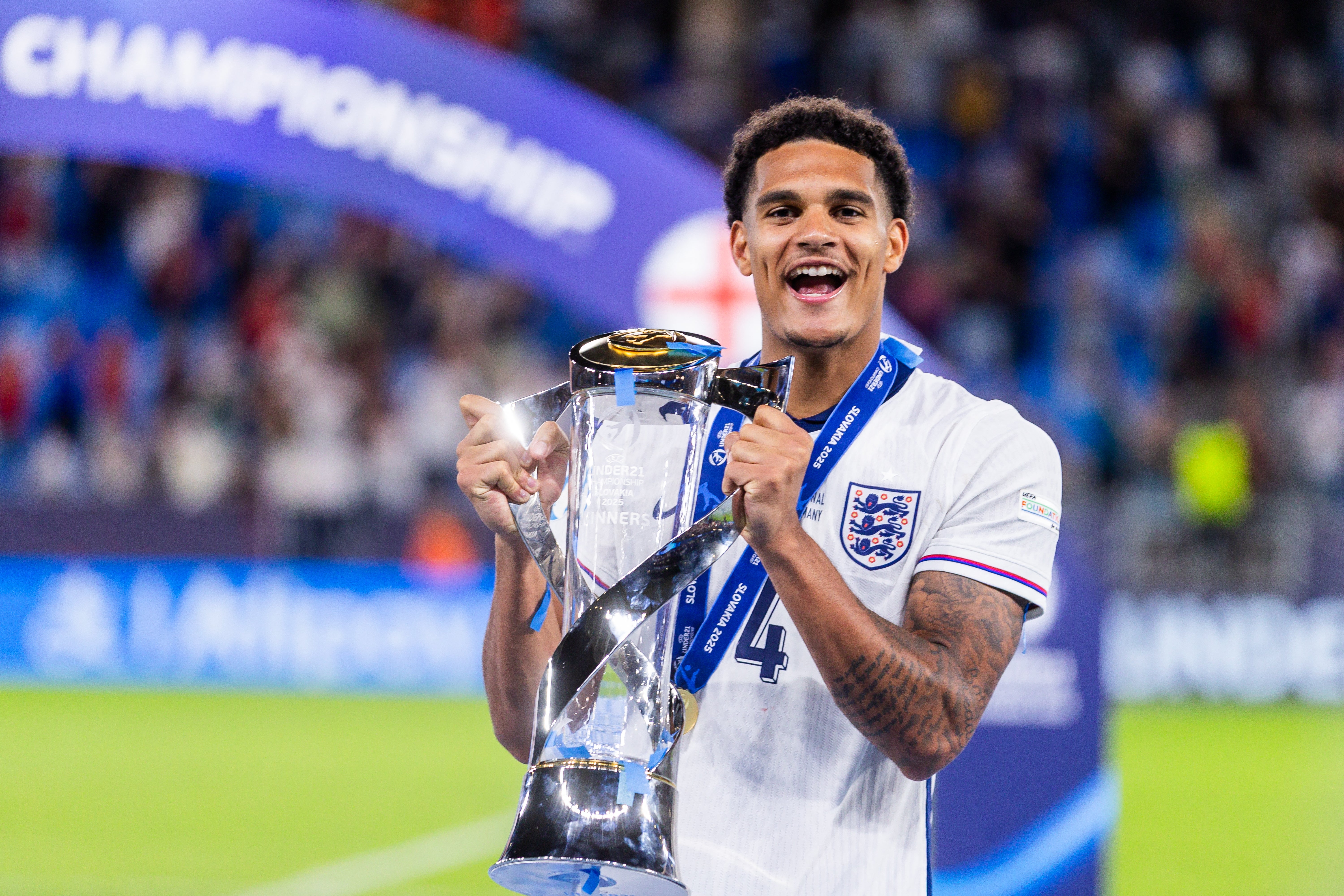 Jarell Quansah holds the trophy as he celebrates after his team won the Uefa U21 European Championship final