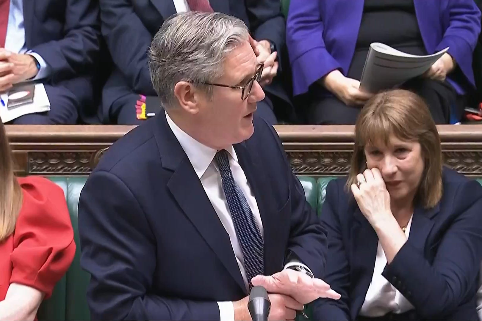 Chancellor of the Exchequer Rachel Reeves (right) crying as Prime Minister Sir Keir Starmer speaks during Prime Minister’s Questions (House of Commons/UK Parliament/PA)