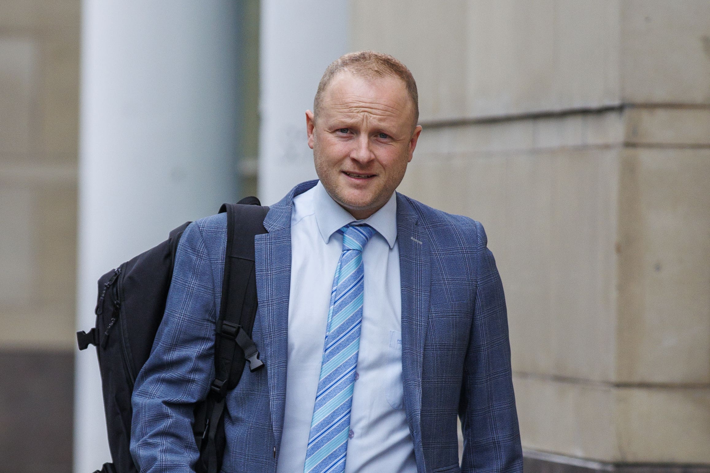 Jamie Bryson arrives at Belfast Crown Court for a previous hearing (Liam McBurney/PA