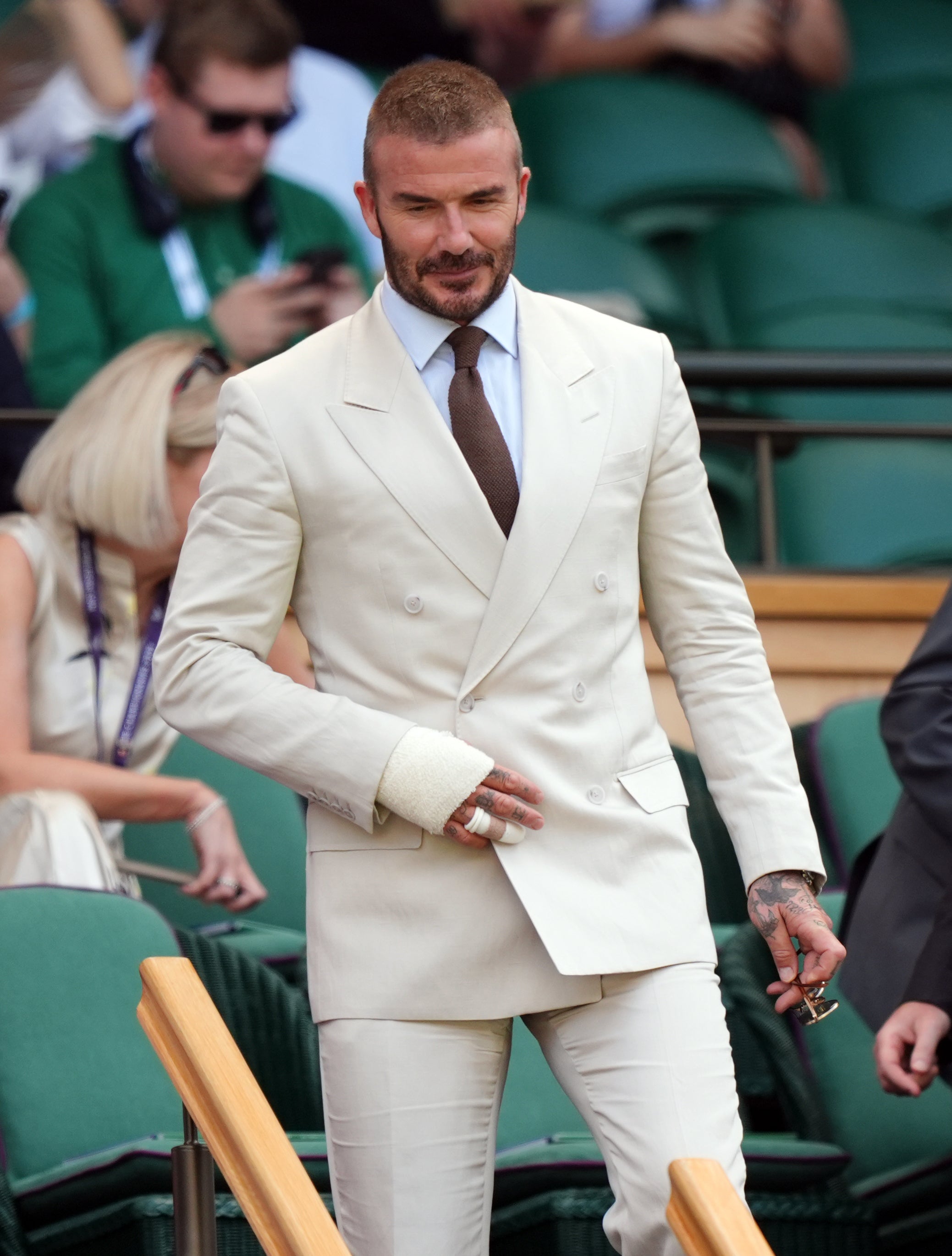 David Beckham wore a cream suit from his own collaboration with Boss