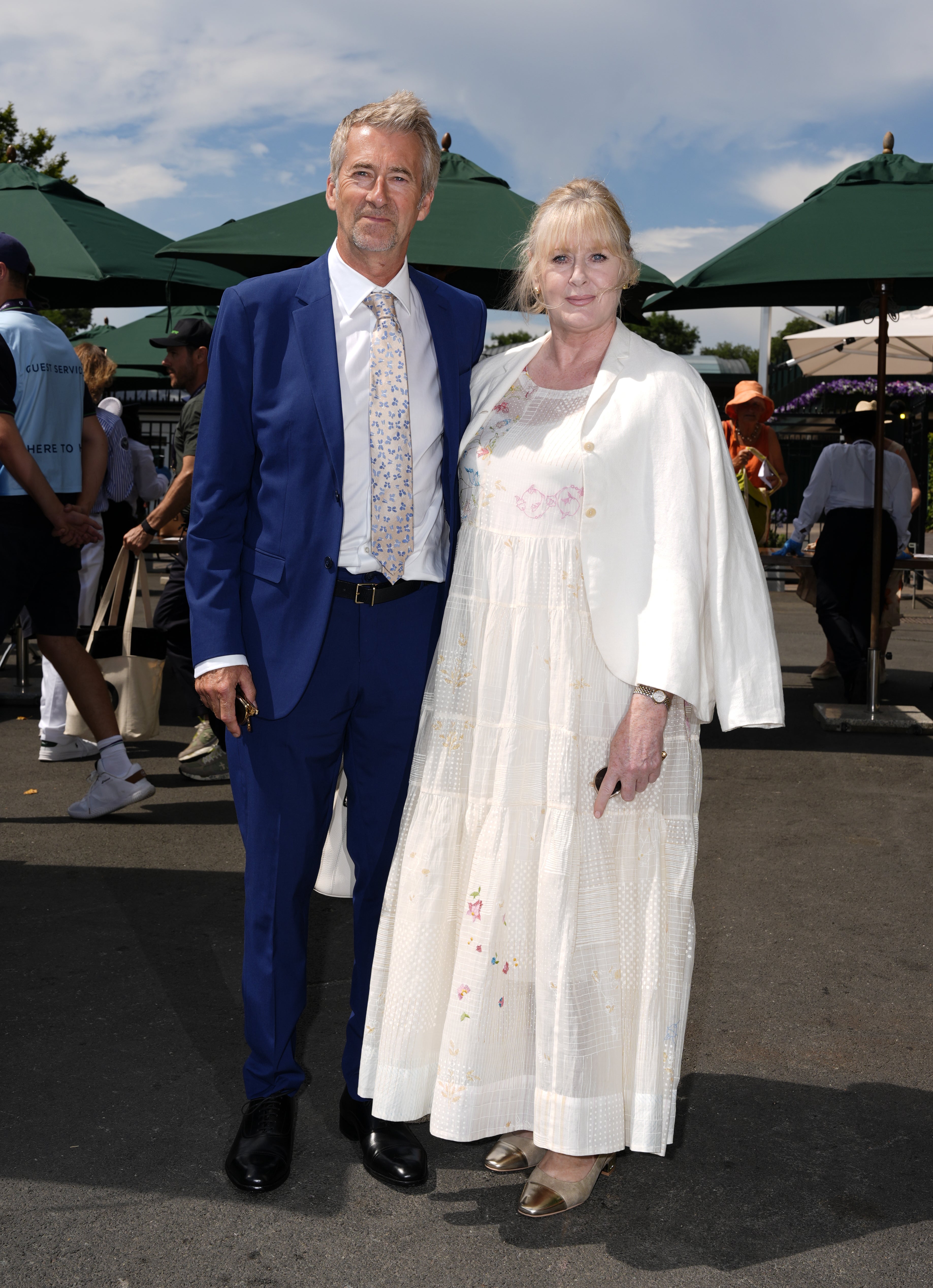 Sarah Lancashire in white and Peter Salmon in blue