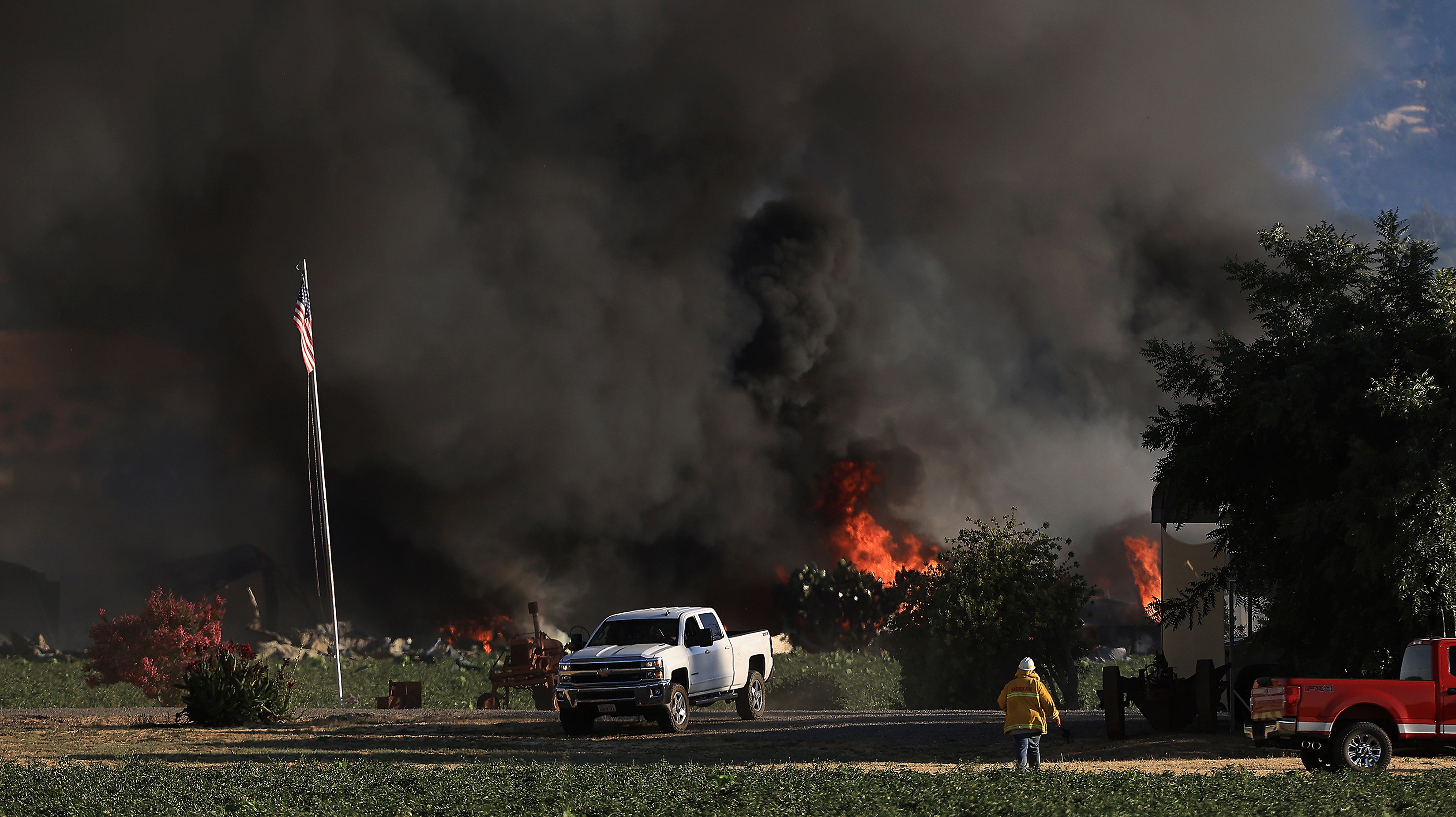 Smoke and flames rise during a fireworks warehouse explosion near Esparto, California
