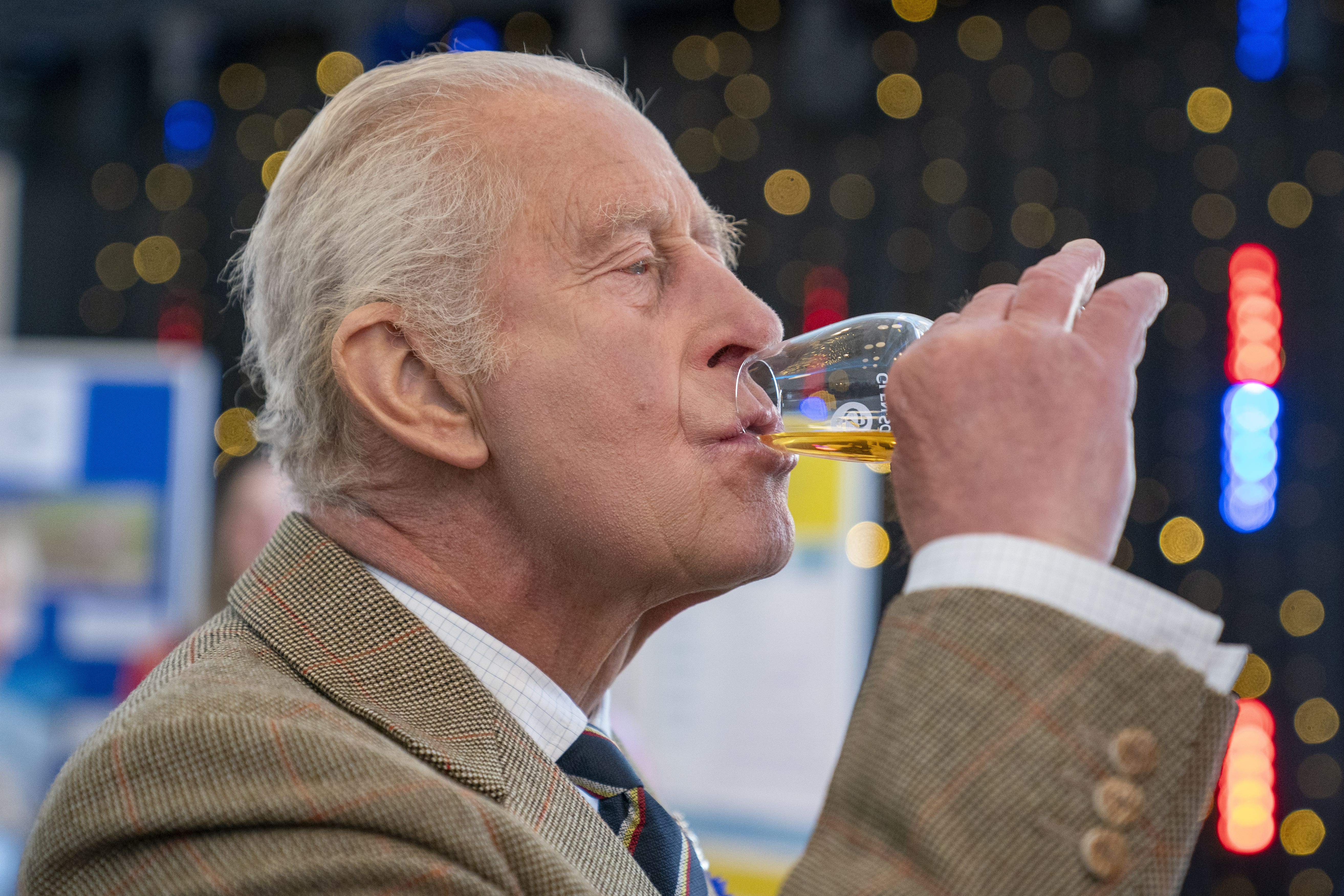The King drinks a glass of whisky (Jane Barlow/PA)