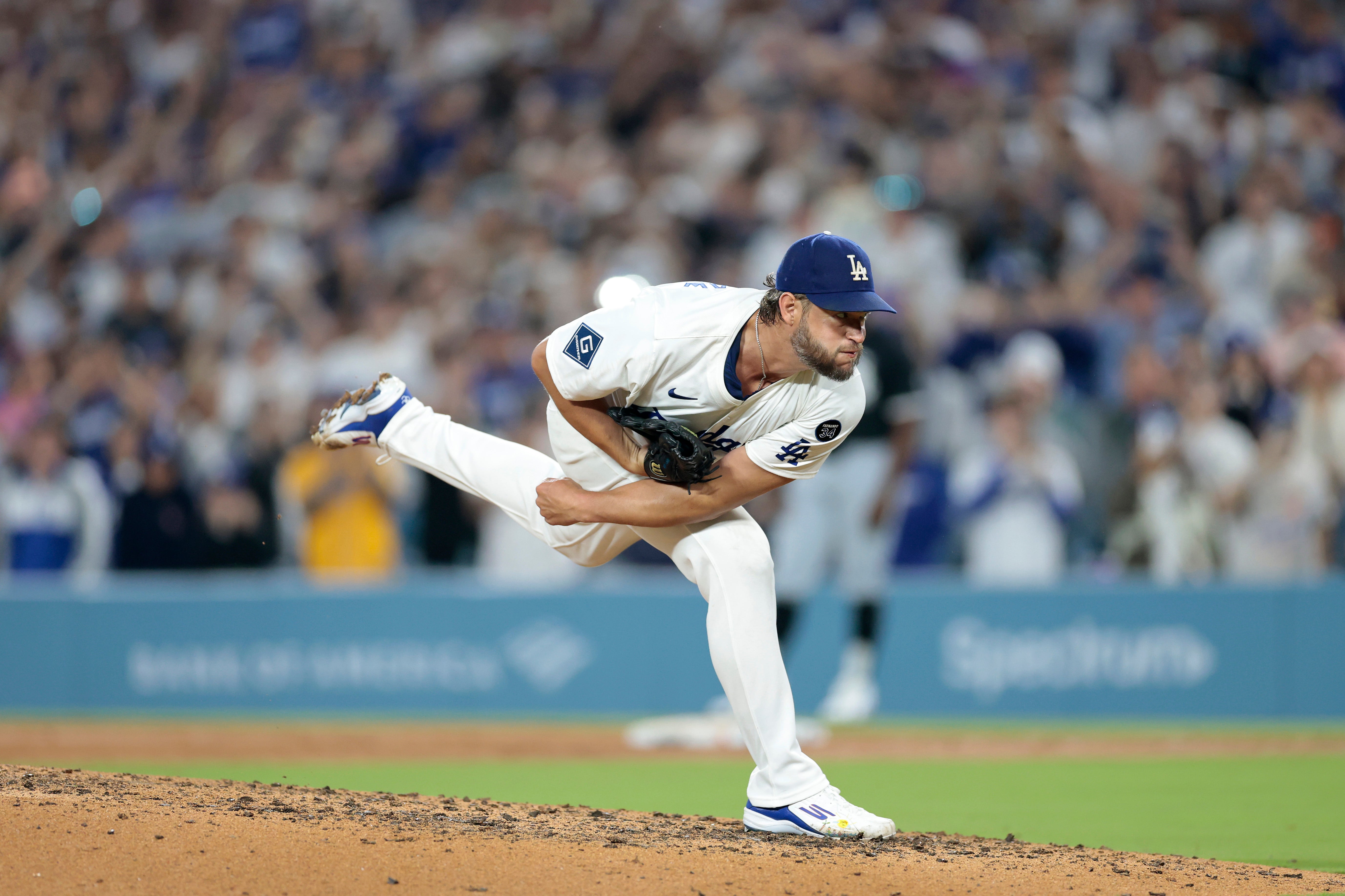 Clayton Kershaw, #22 of the Los Angeles Dodgers, strikes out Vinny Capra, #41 of the Chicago White Sox, during the sixth inning to record his 3,000th career strikeout