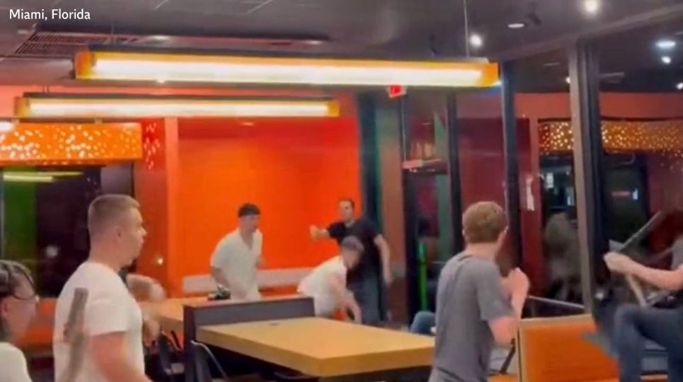 The customer catches the second chair thrown at him