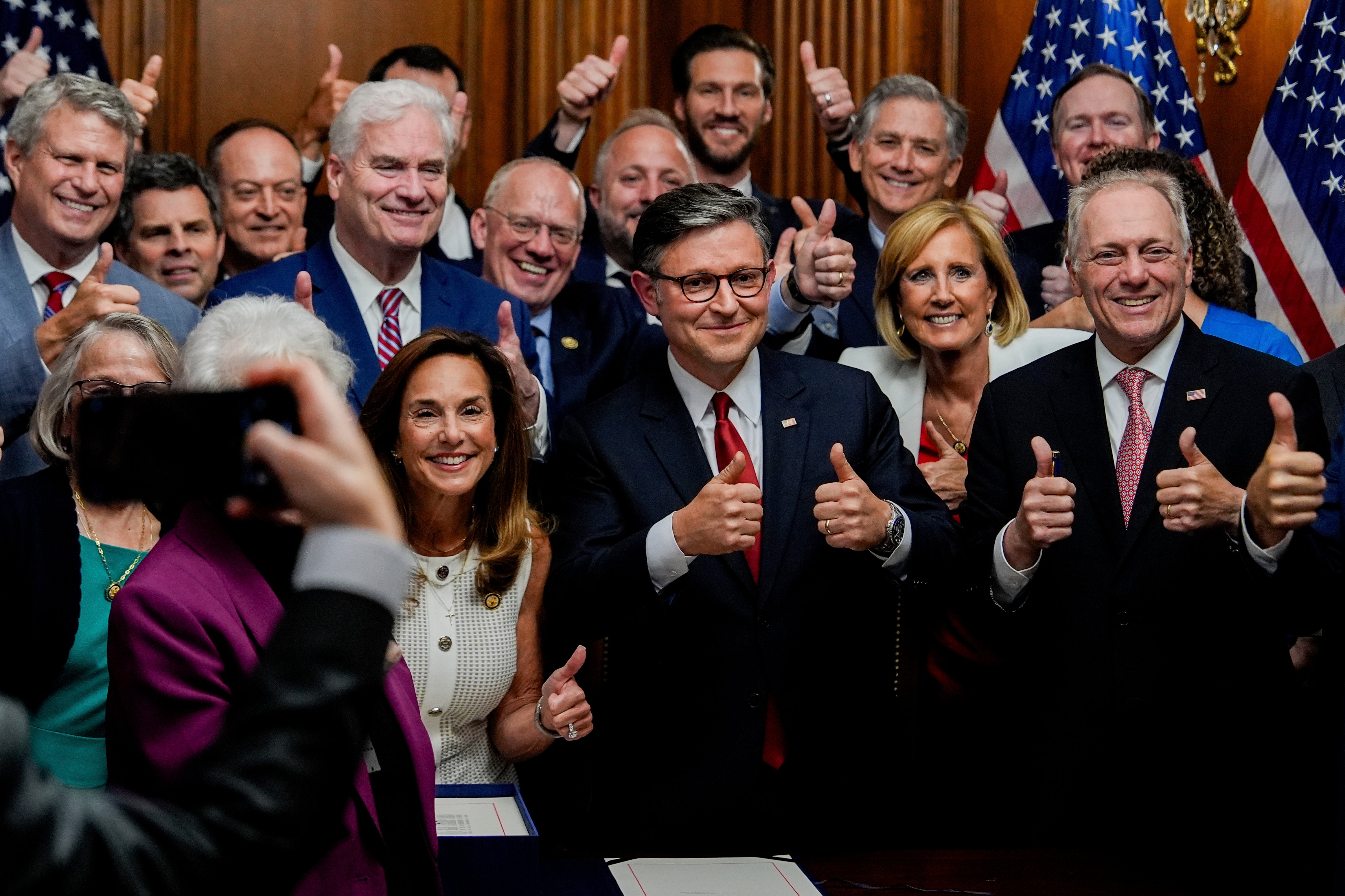 After the bill passed, Republicans danced in the House to Village People’s Y.M.C.A, one of the President’s preferred rally songs, hugged each other and posed for photographs with thumbs up.